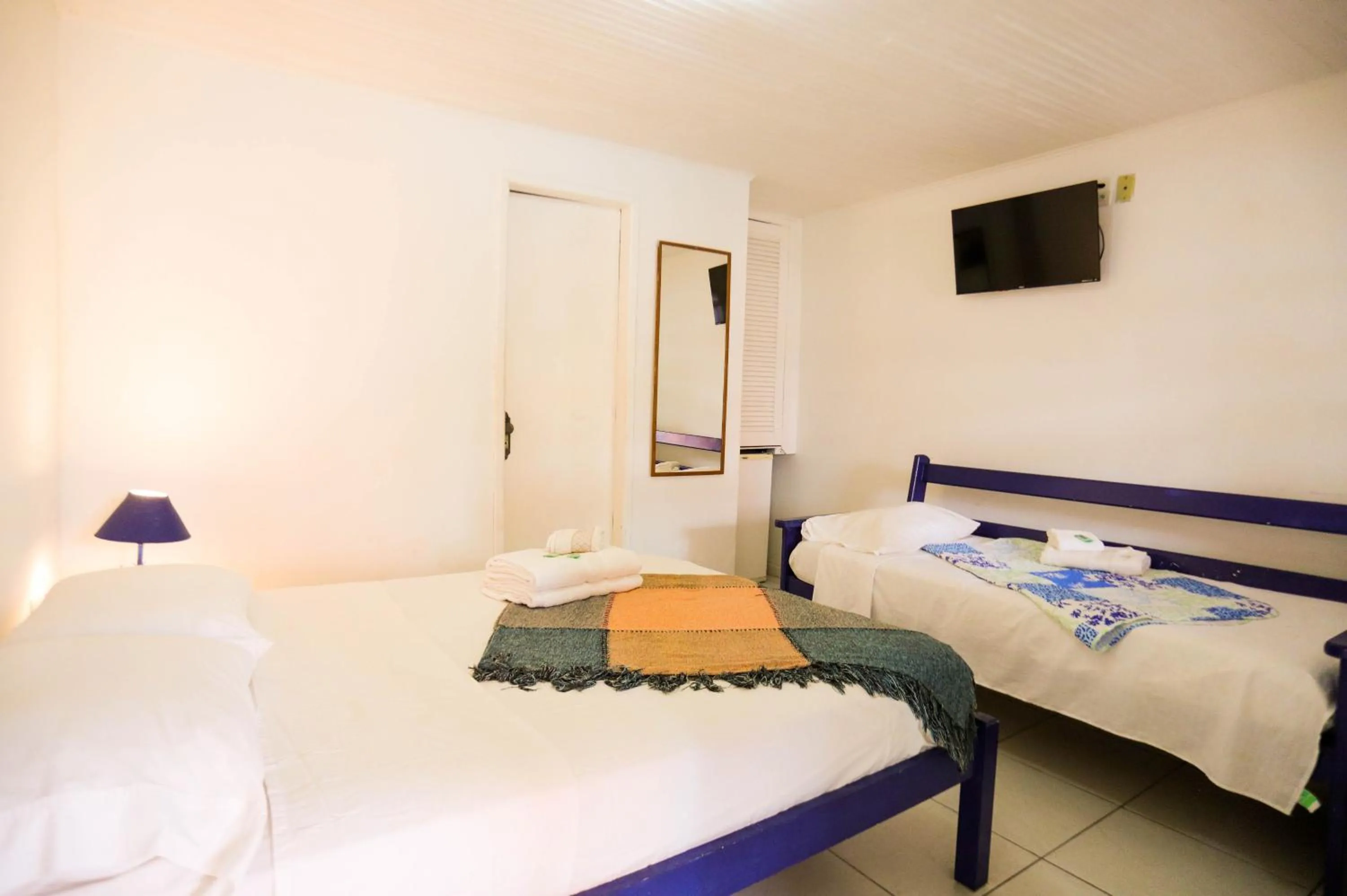 Bed in POUSADA AMENDOEIRA