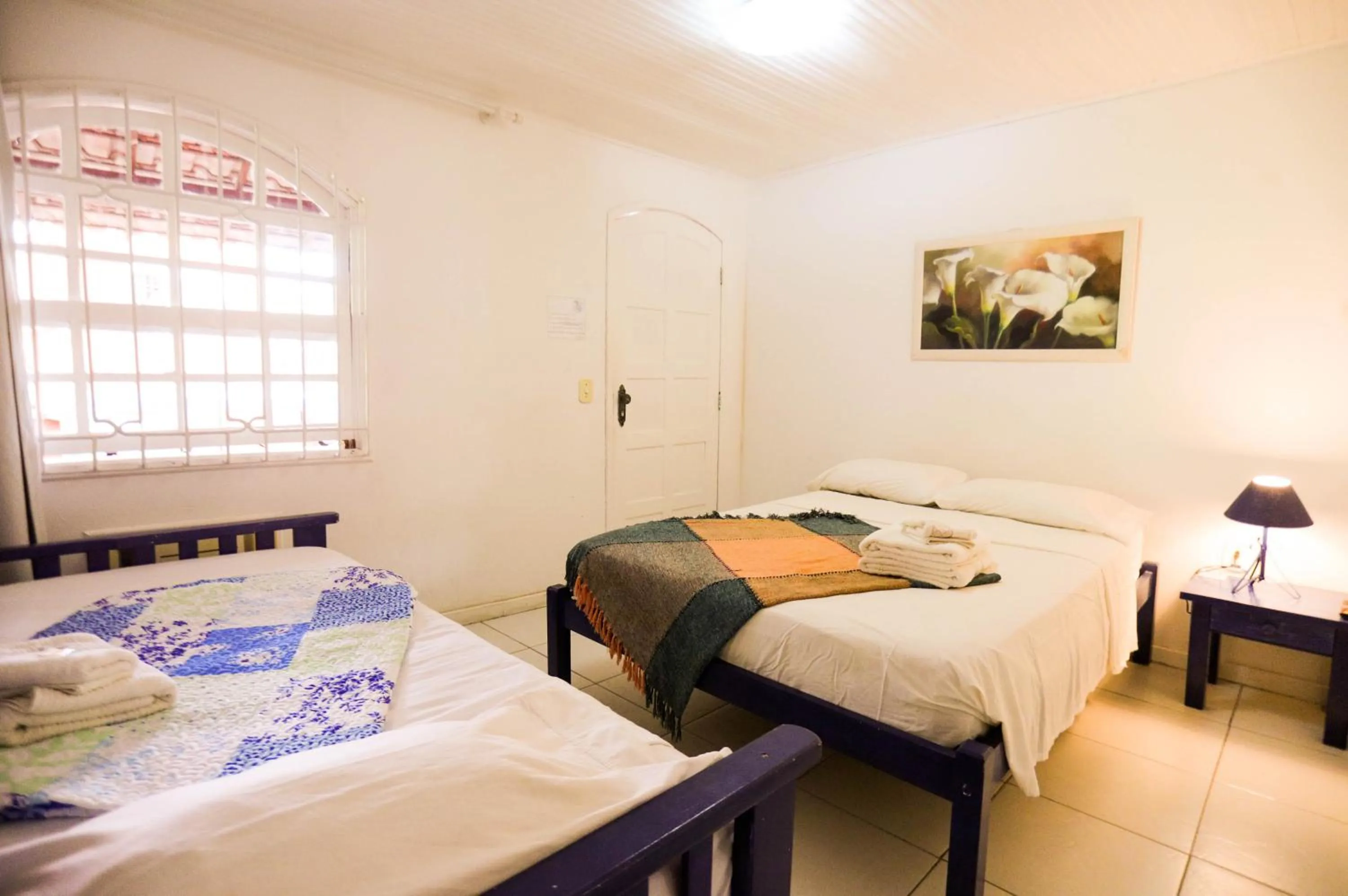 Bed in POUSADA AMENDOEIRA