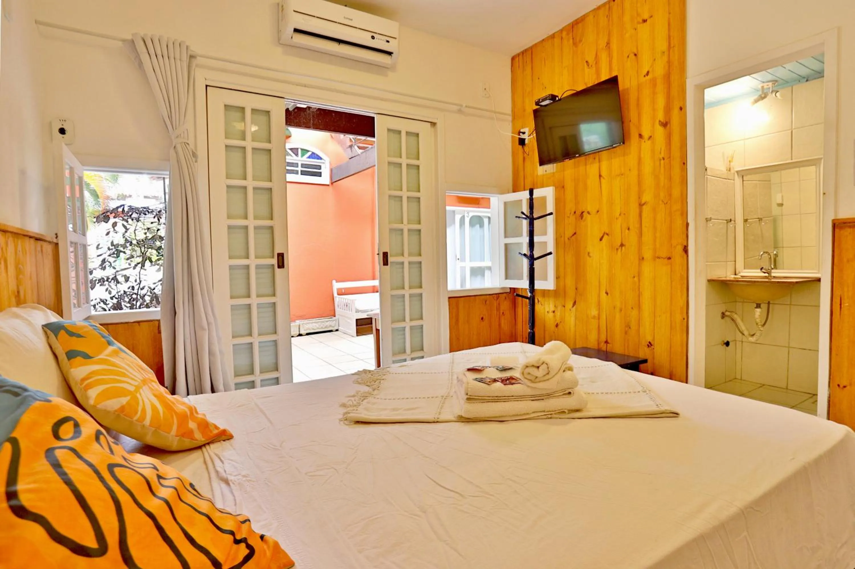 Photo of the whole room, Bed in POUSADA AMENDOEIRA