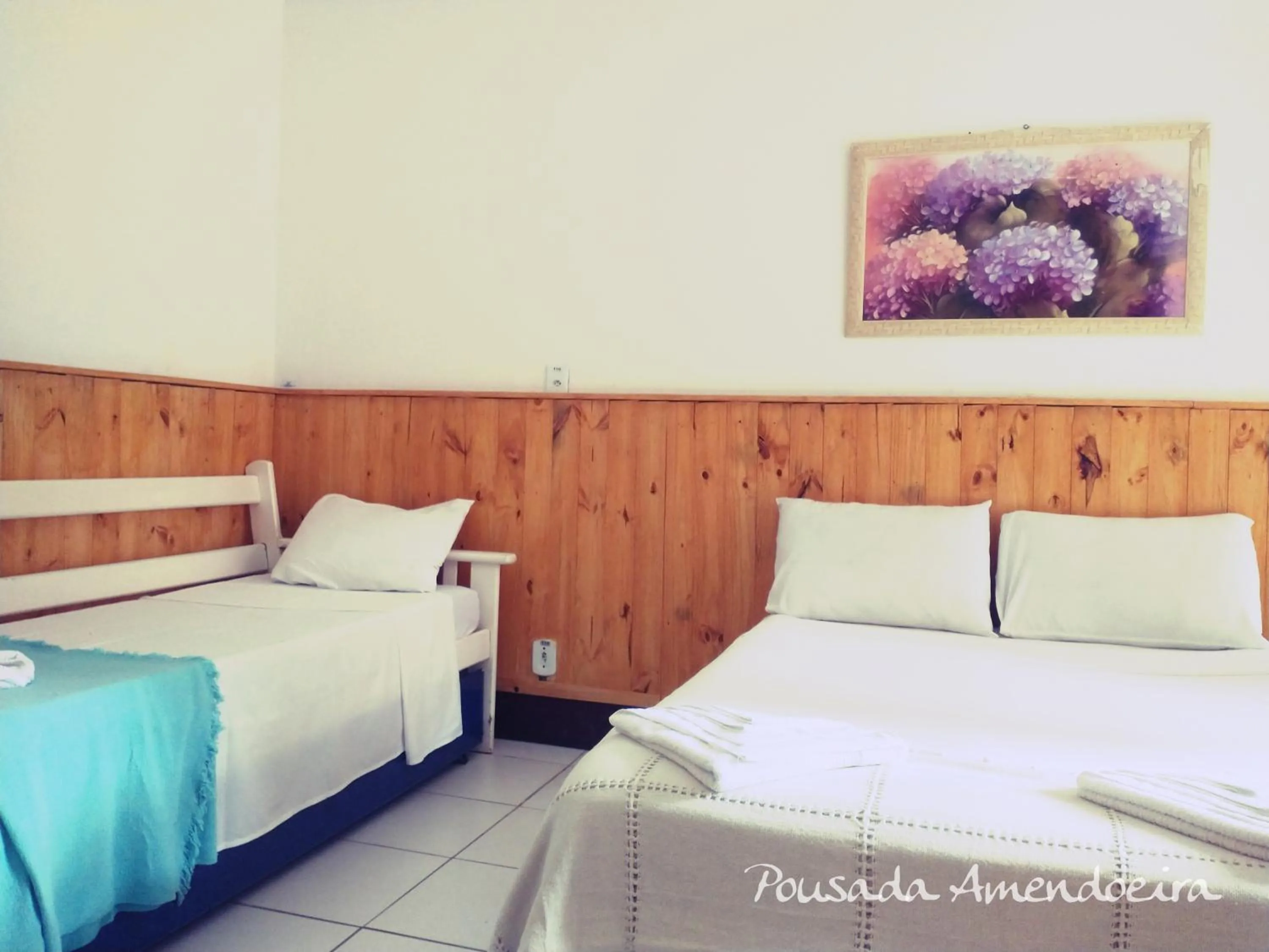 Bed in POUSADA AMENDOEIRA