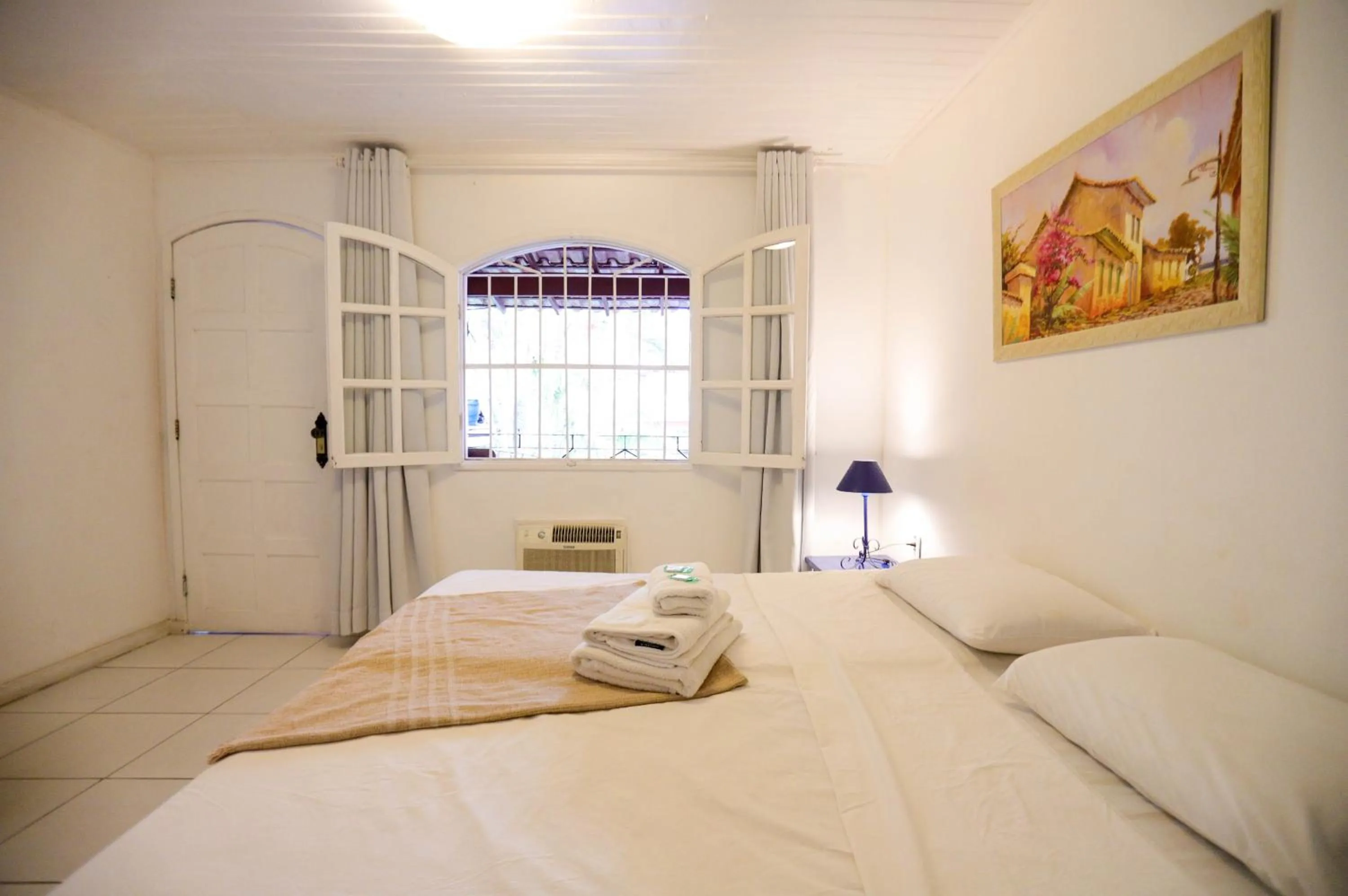 Bed in POUSADA AMENDOEIRA