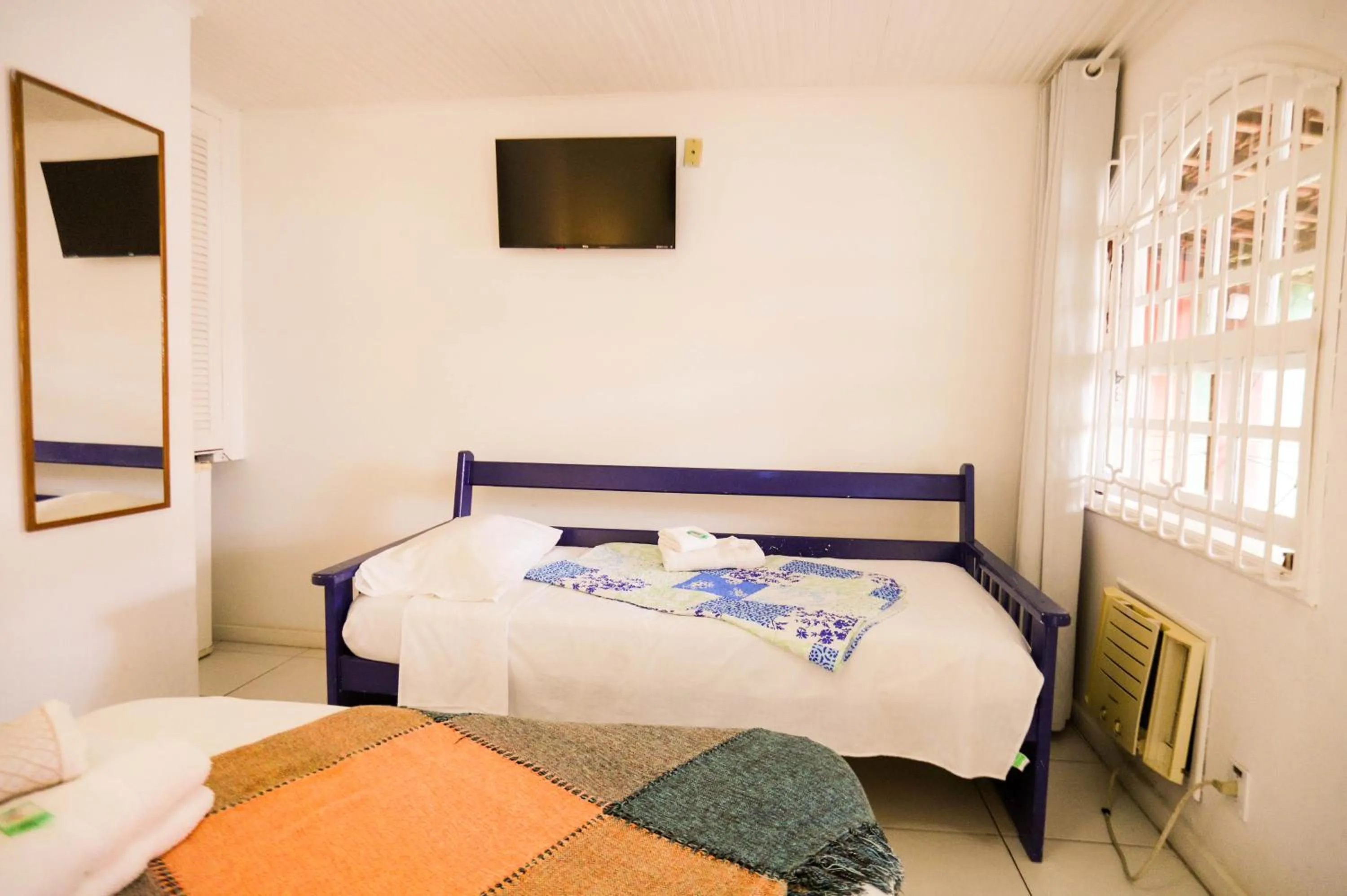 Bed in POUSADA AMENDOEIRA