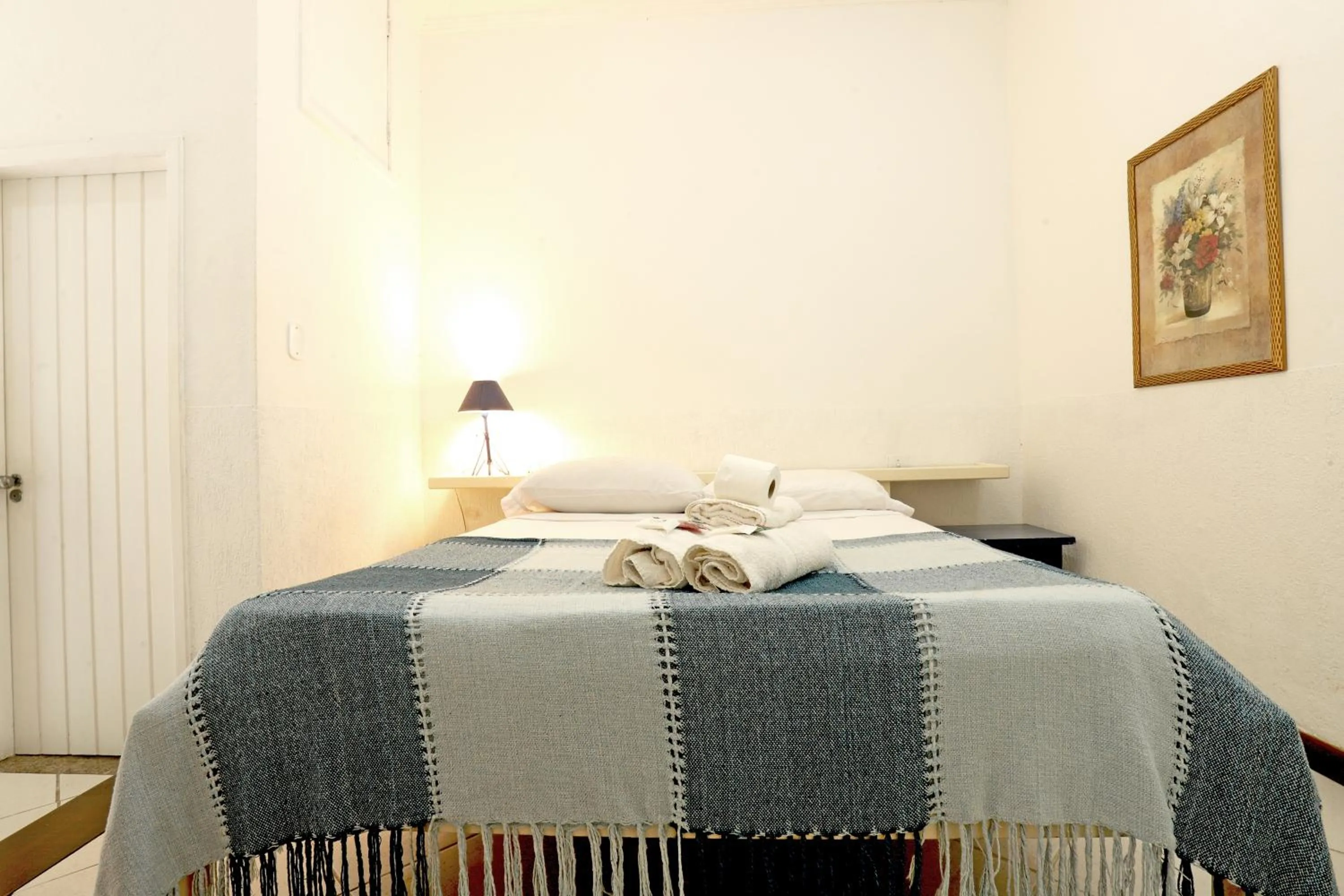 Bed in POUSADA AMENDOEIRA