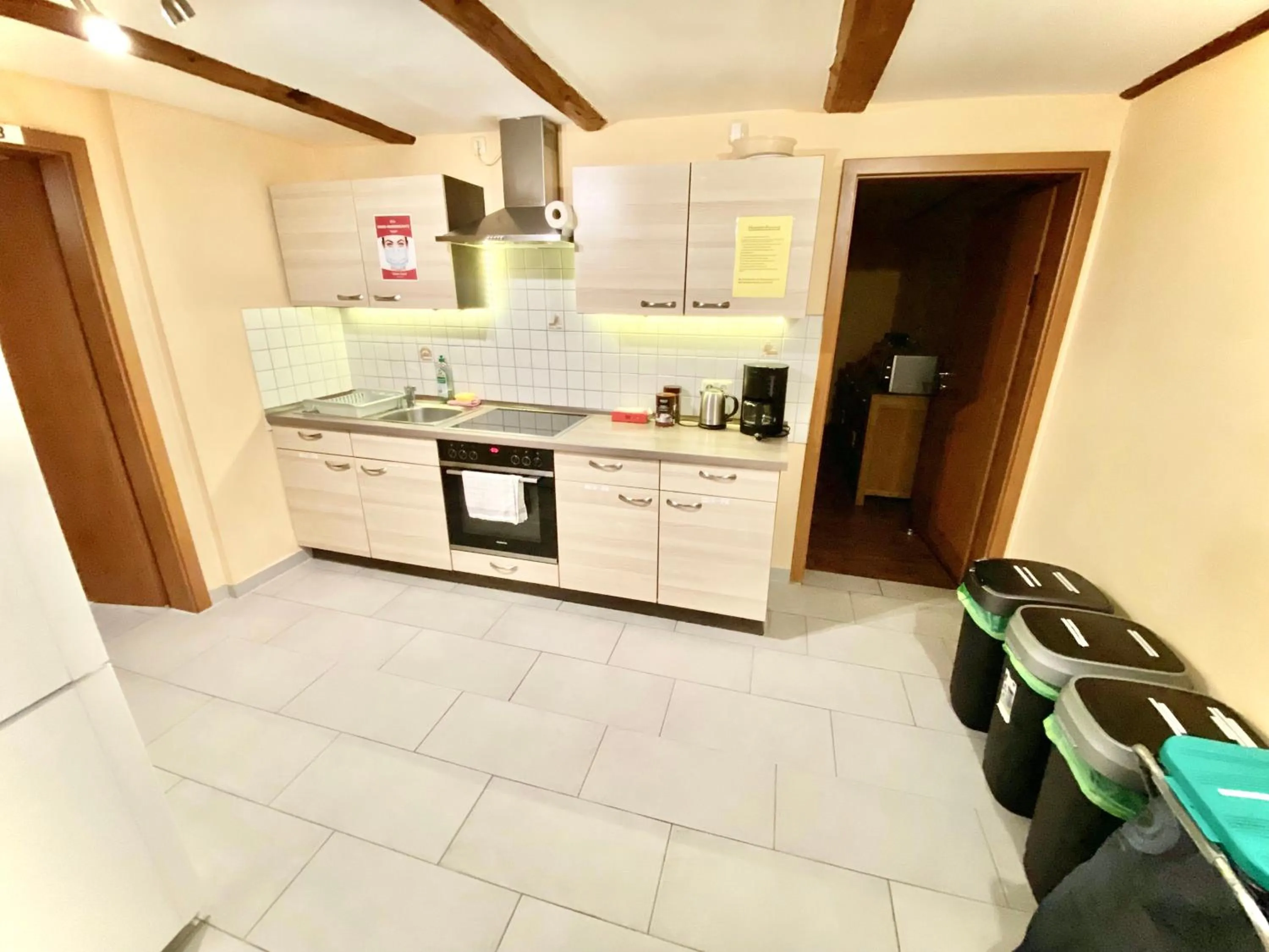 Communal kitchen in Pension Laurent Ranch