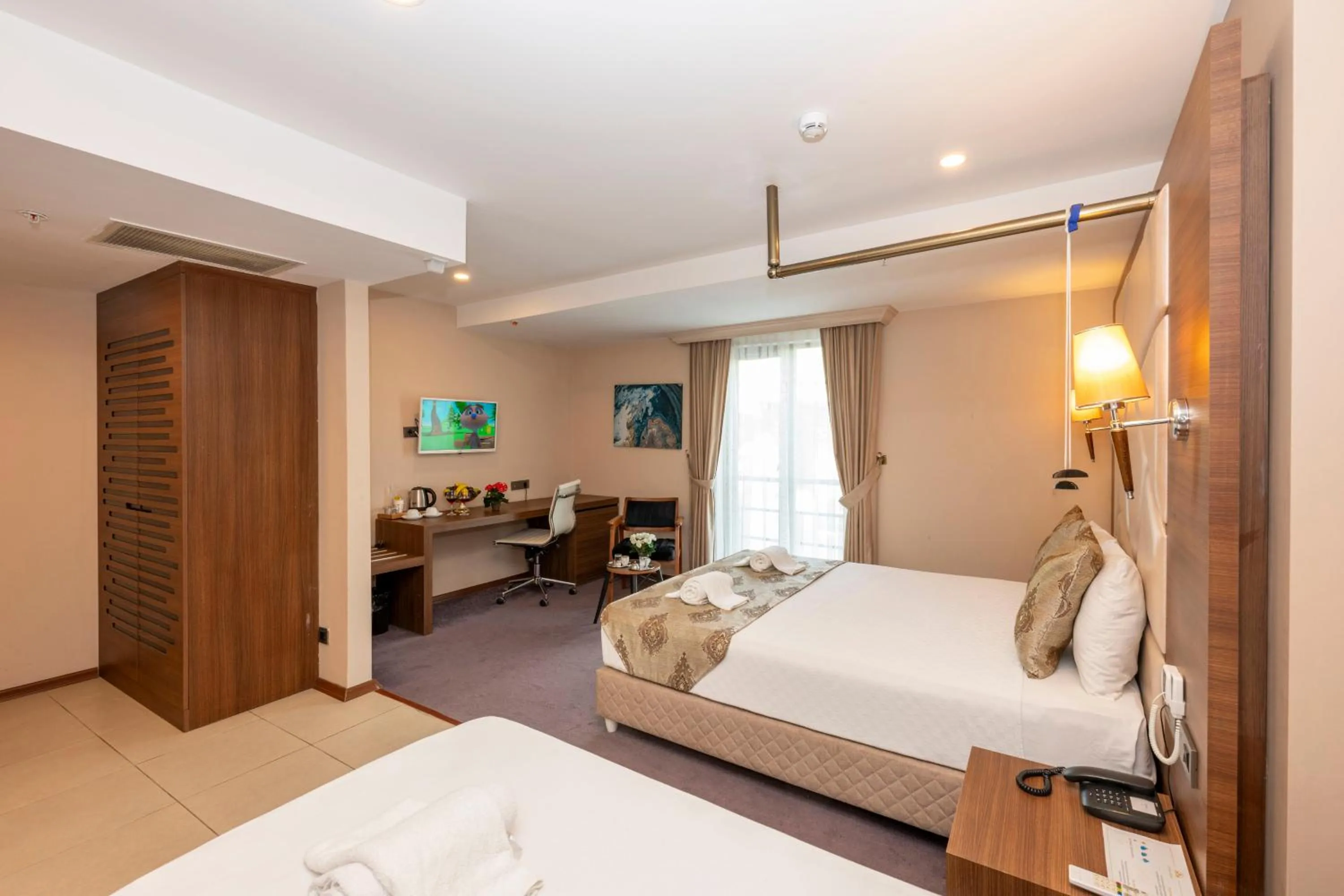 Bed in Litros Hotel & Spa