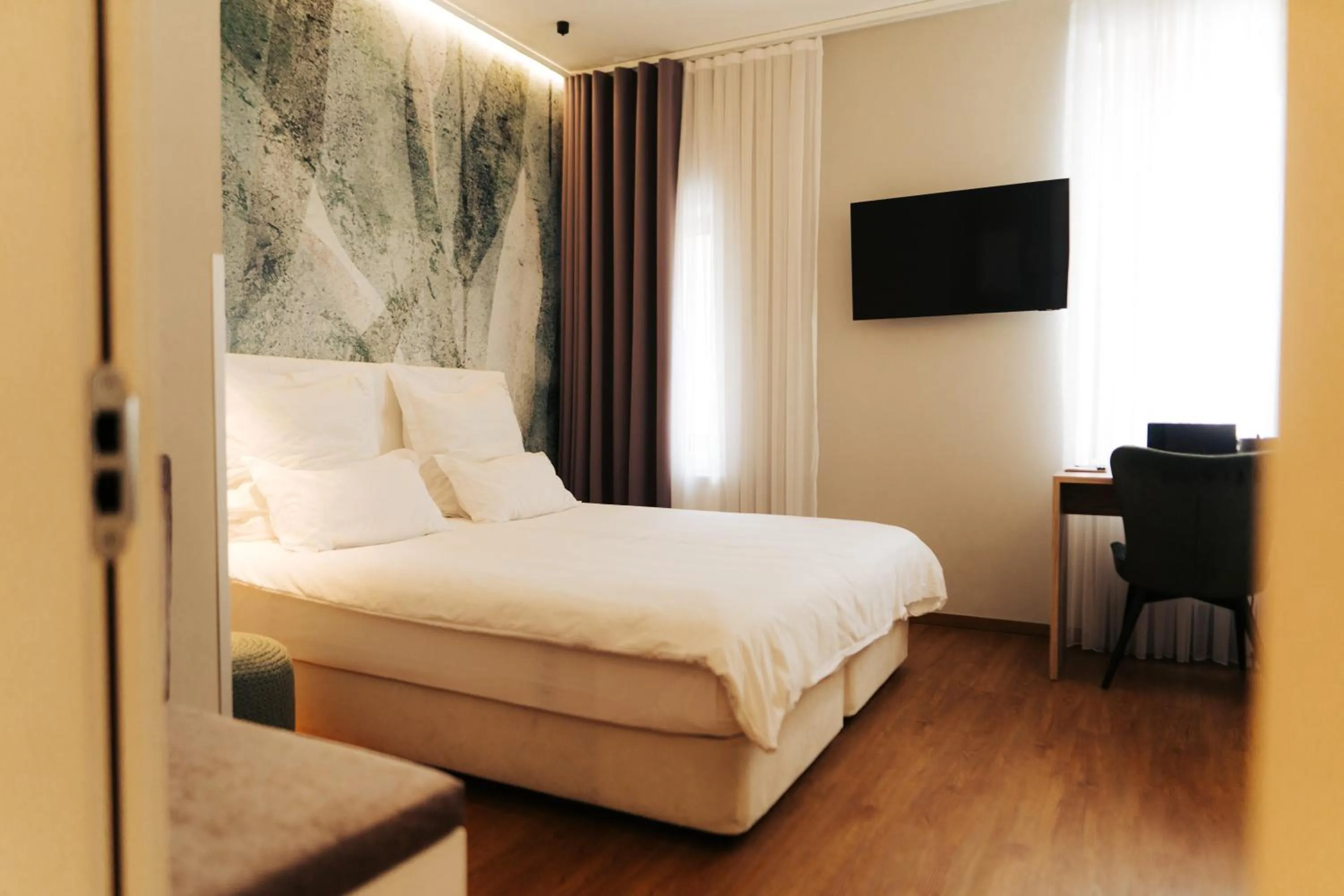 Bed in The Kepos Hotel Erlangen