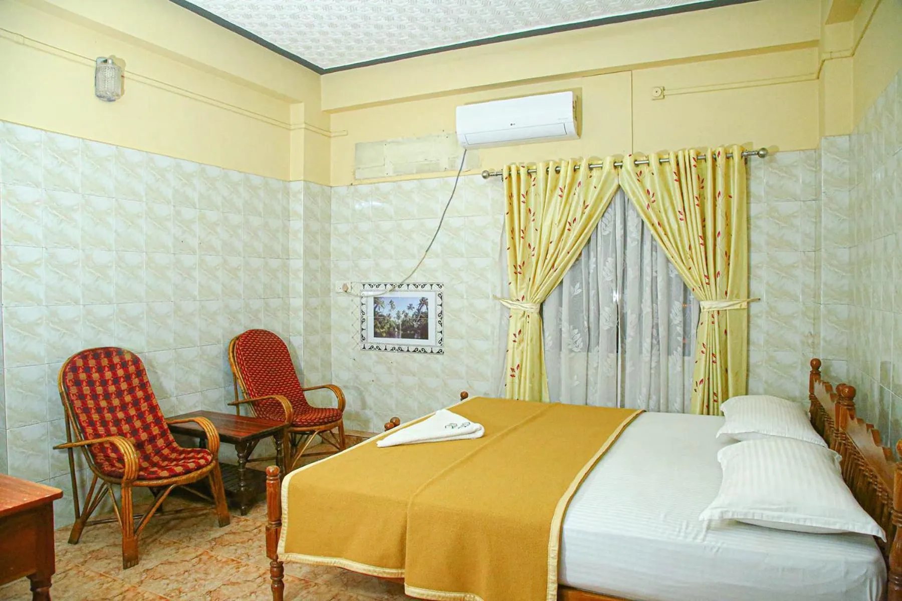 Bed in Lake Palace Family Resort Kumarakom