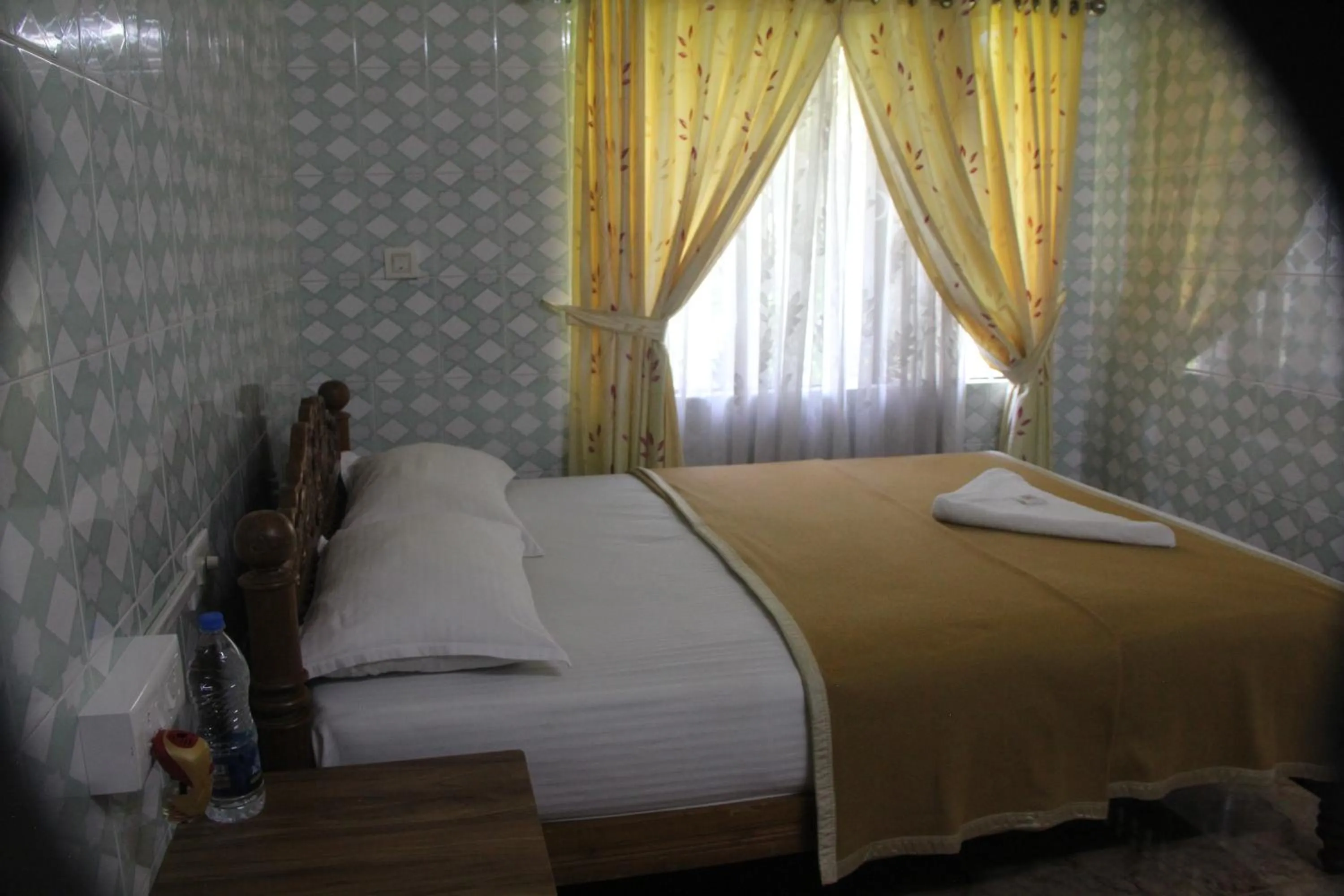 Bed in Lake Palace Family Resort Kumarakom