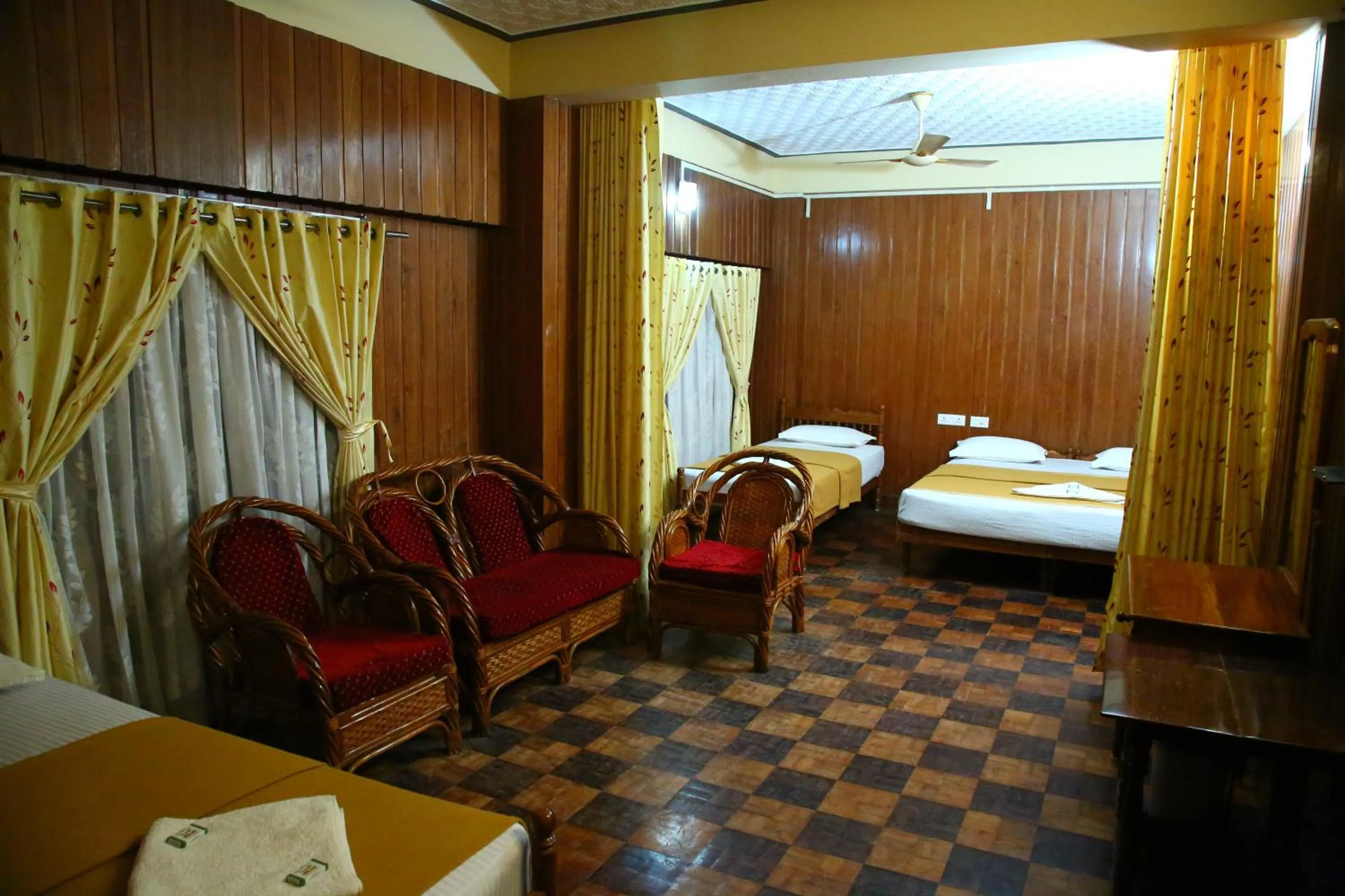 Bed in Lake Palace Family Resort Kumarakom