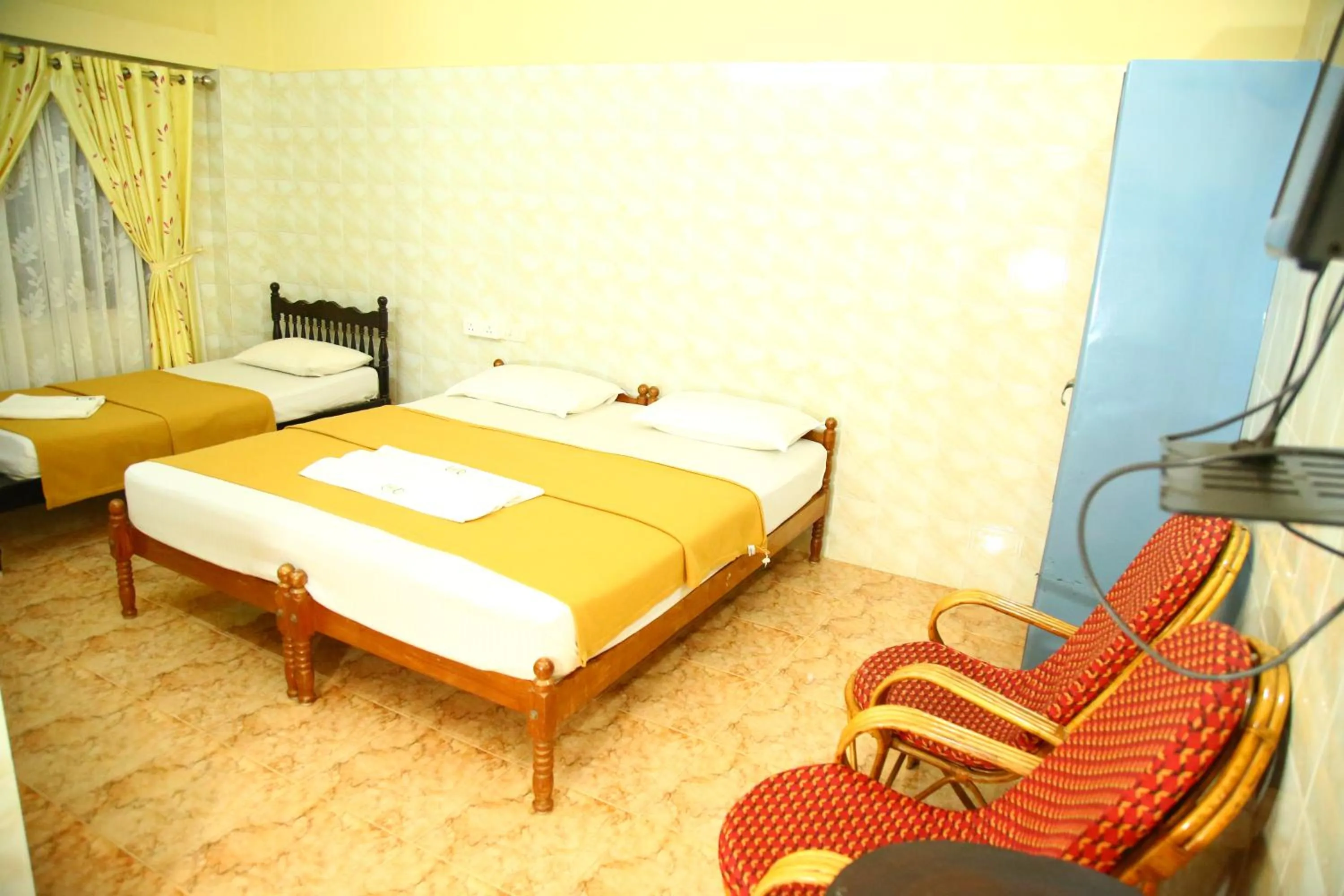 Bed in Lake Palace Family Resort Kumarakom