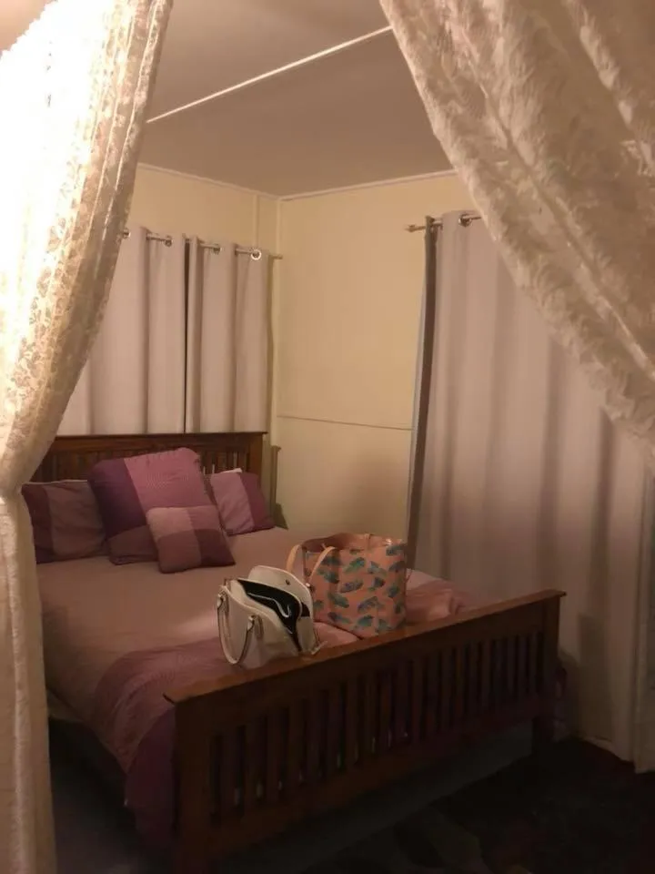 Bed in Christmas Creek Café & Cabins