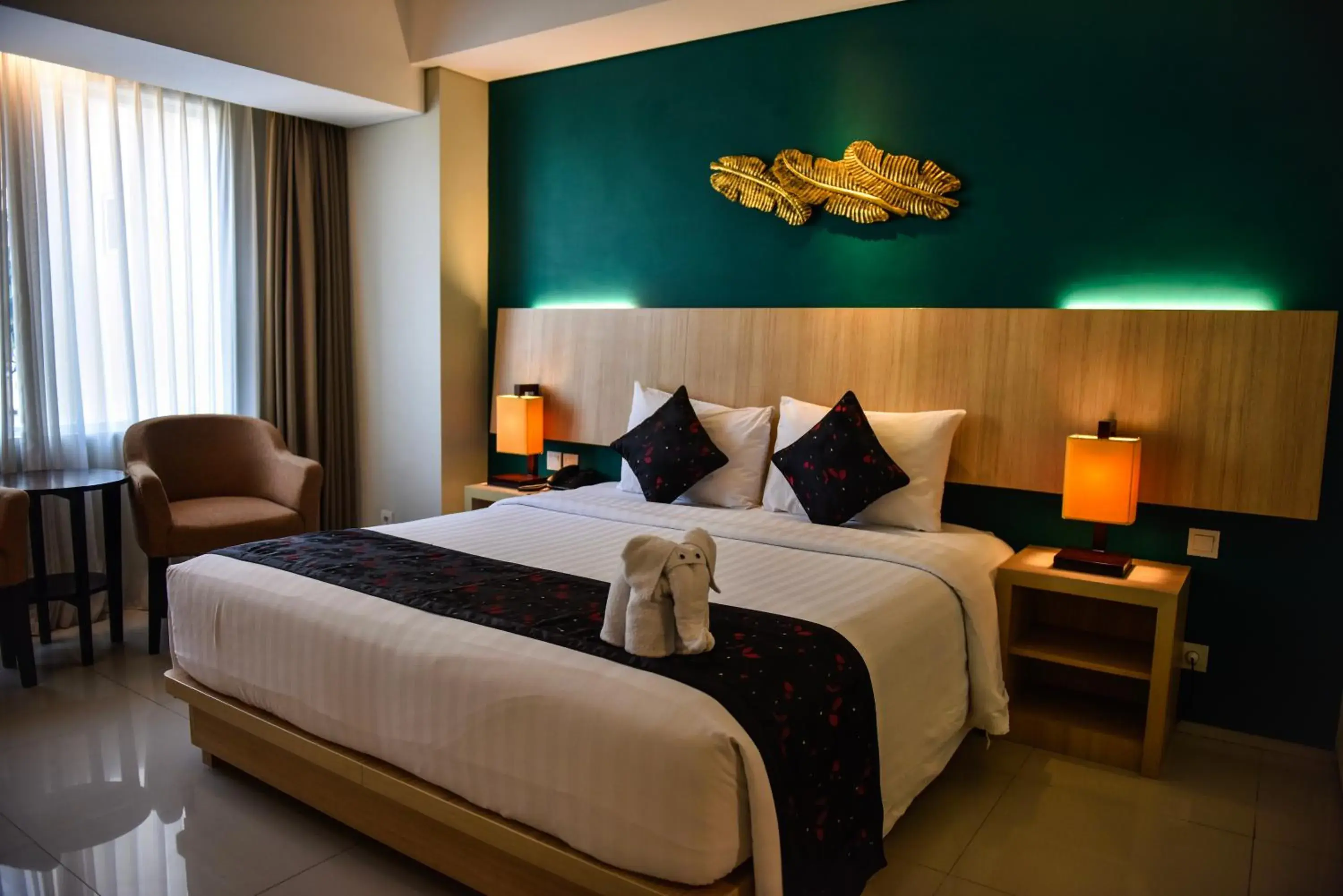 Bed in The Kana Kuta Hotel Bed in The Kana Kuta Hotel