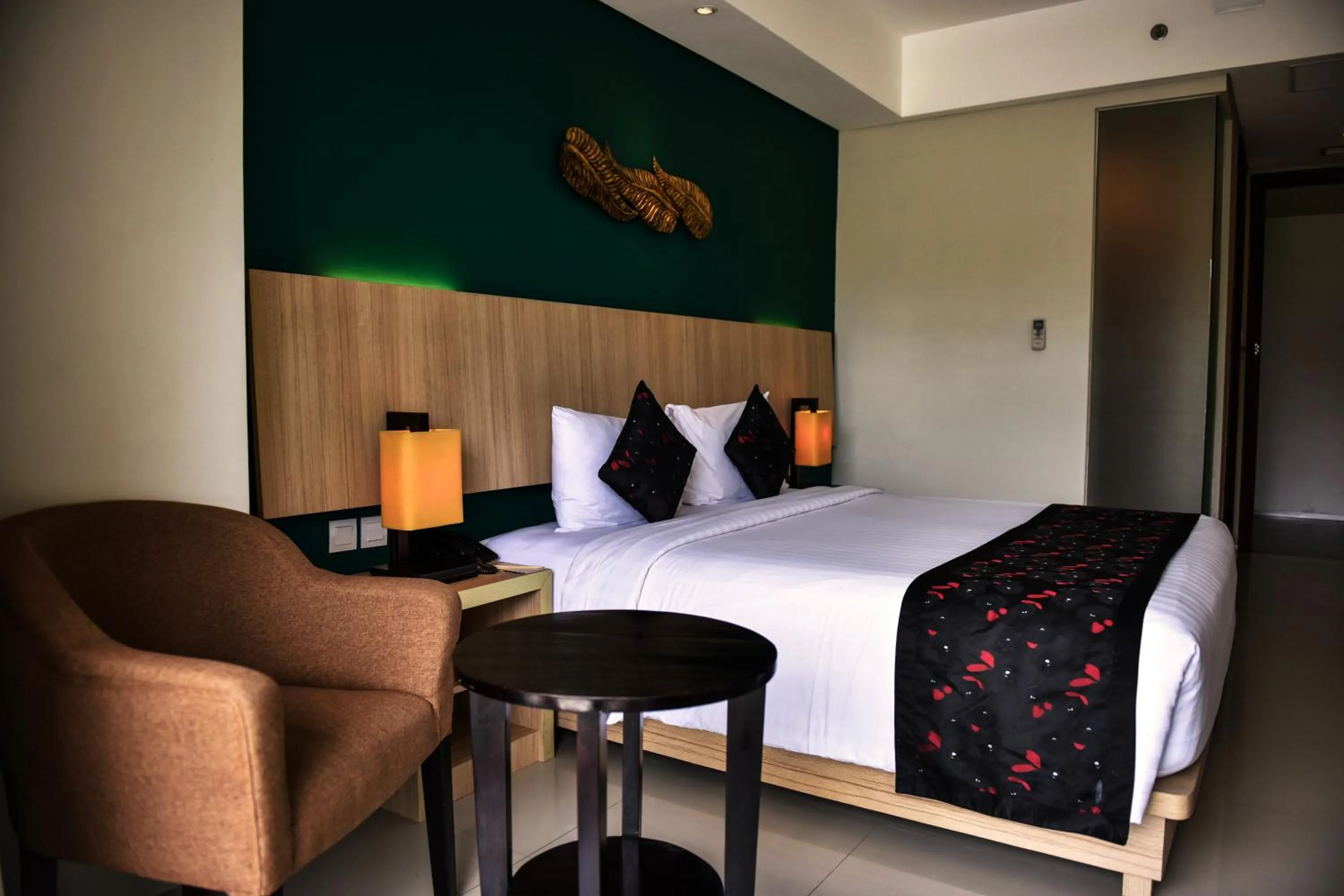 Bed in The Kana Kuta Hotel