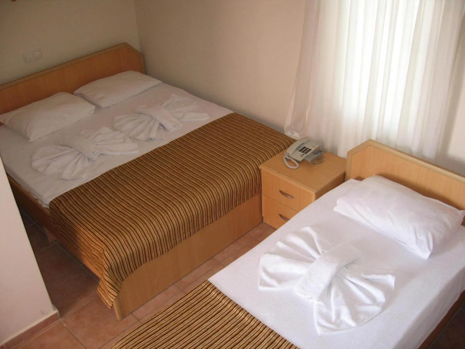 Photo of the whole room, Bed in MG Moms Hotel