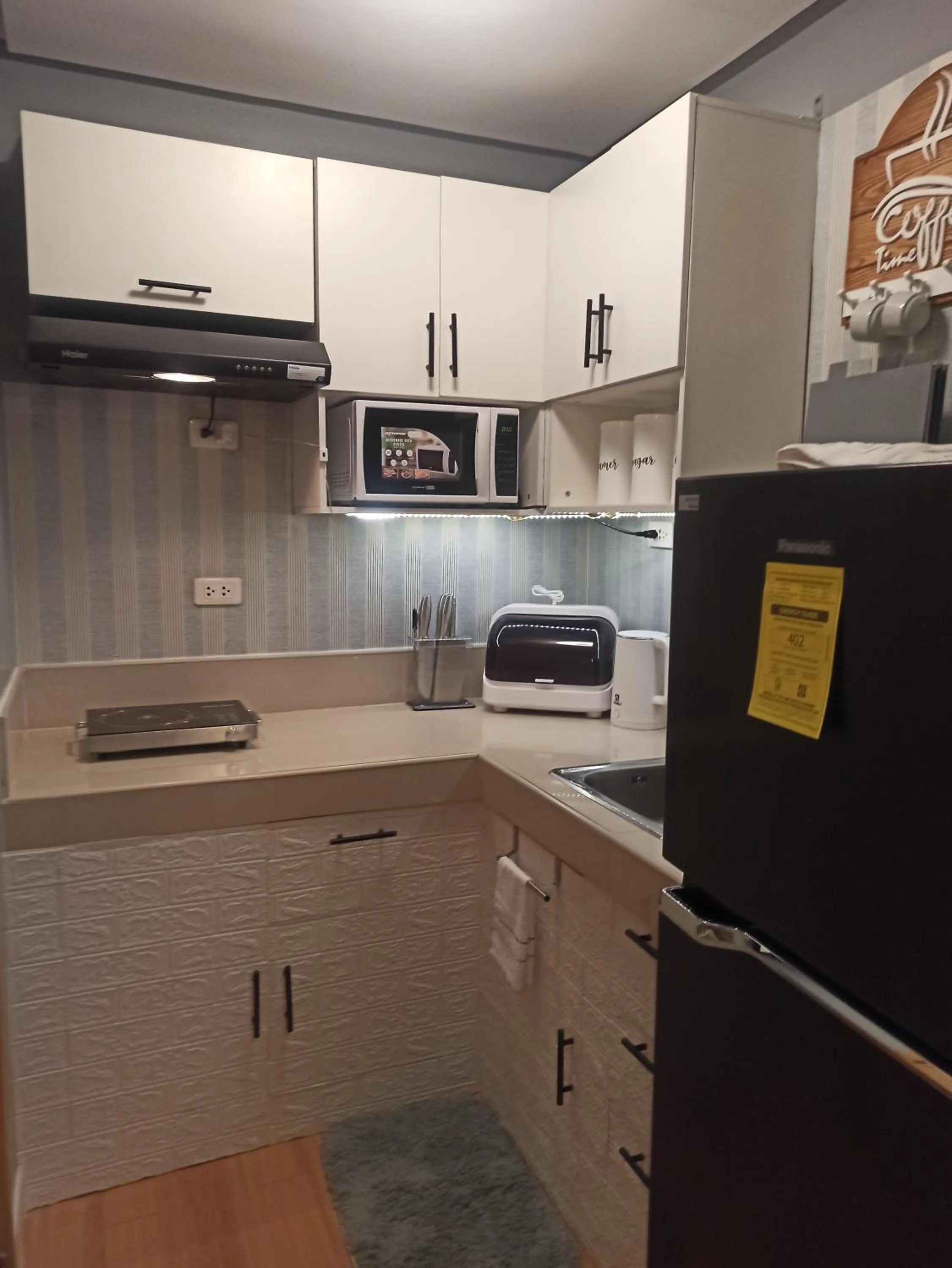 Kitchen or kitchenette in 2-Bedroom CK's Corner Staycation Trees Residences