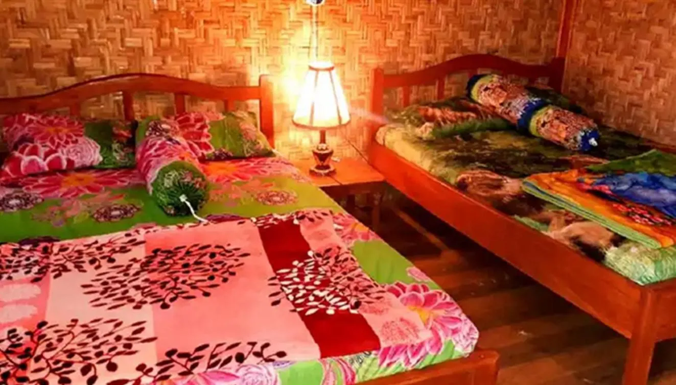 Bed in Ijen Miner Family Homestay