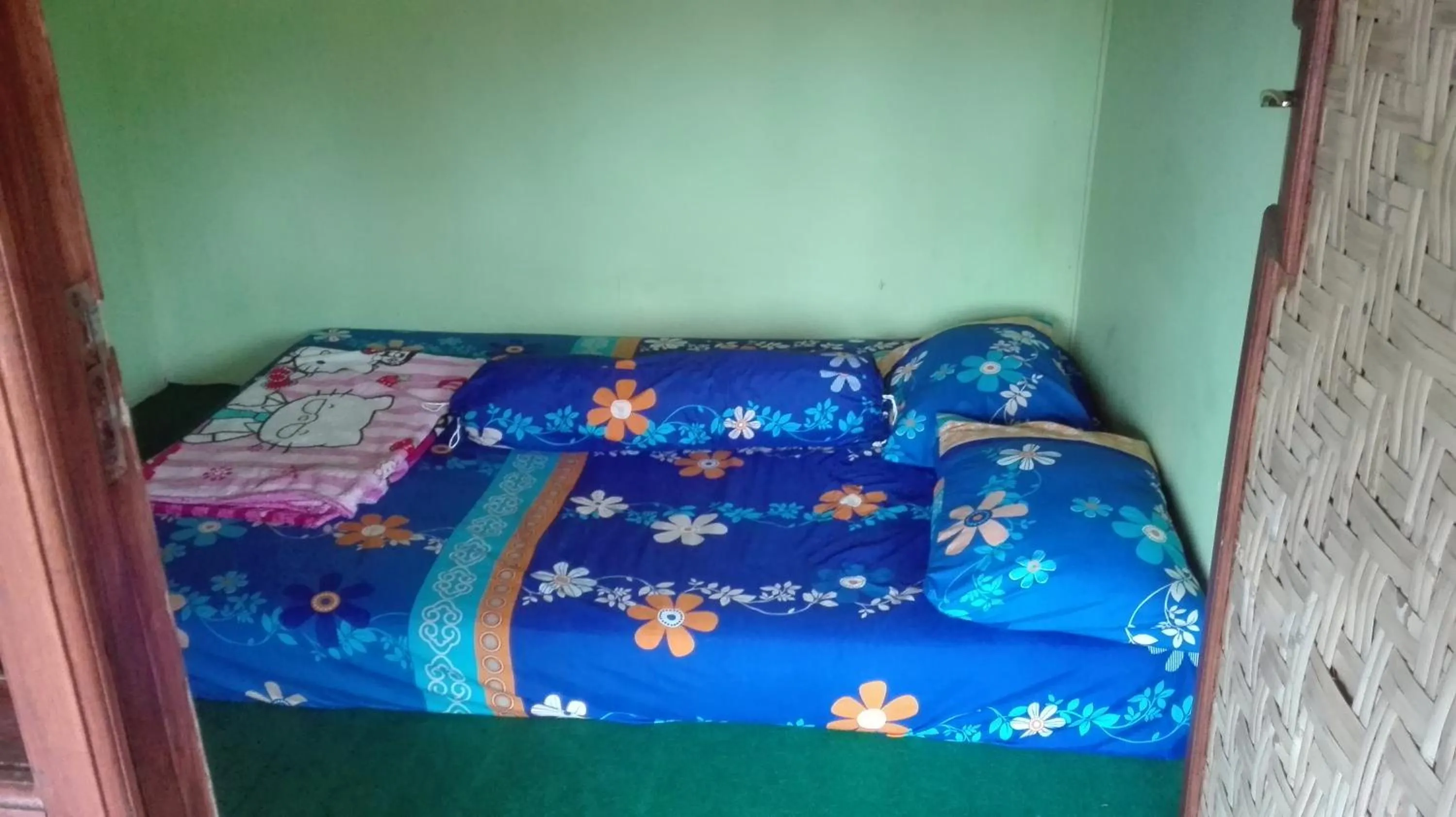Bed in Ijen Miner Family Homestay