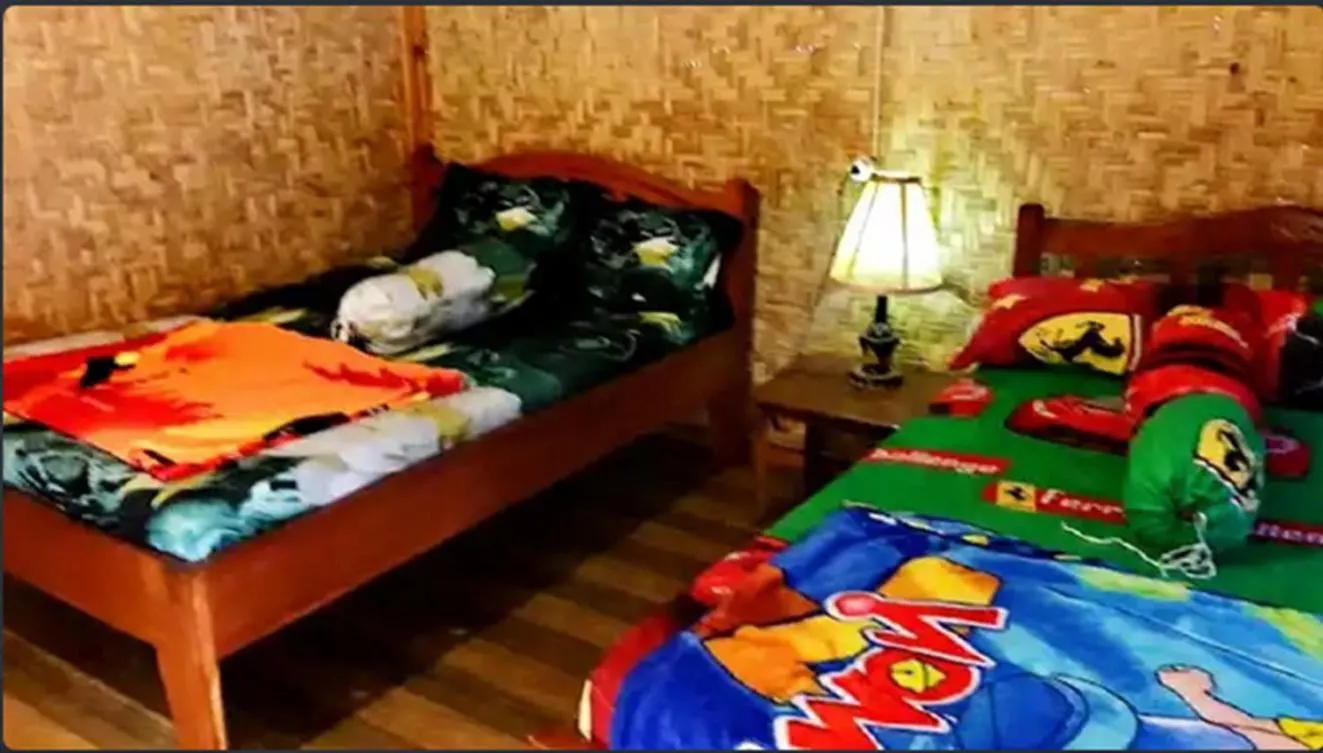 Bed in Ijen Miner Family Homestay