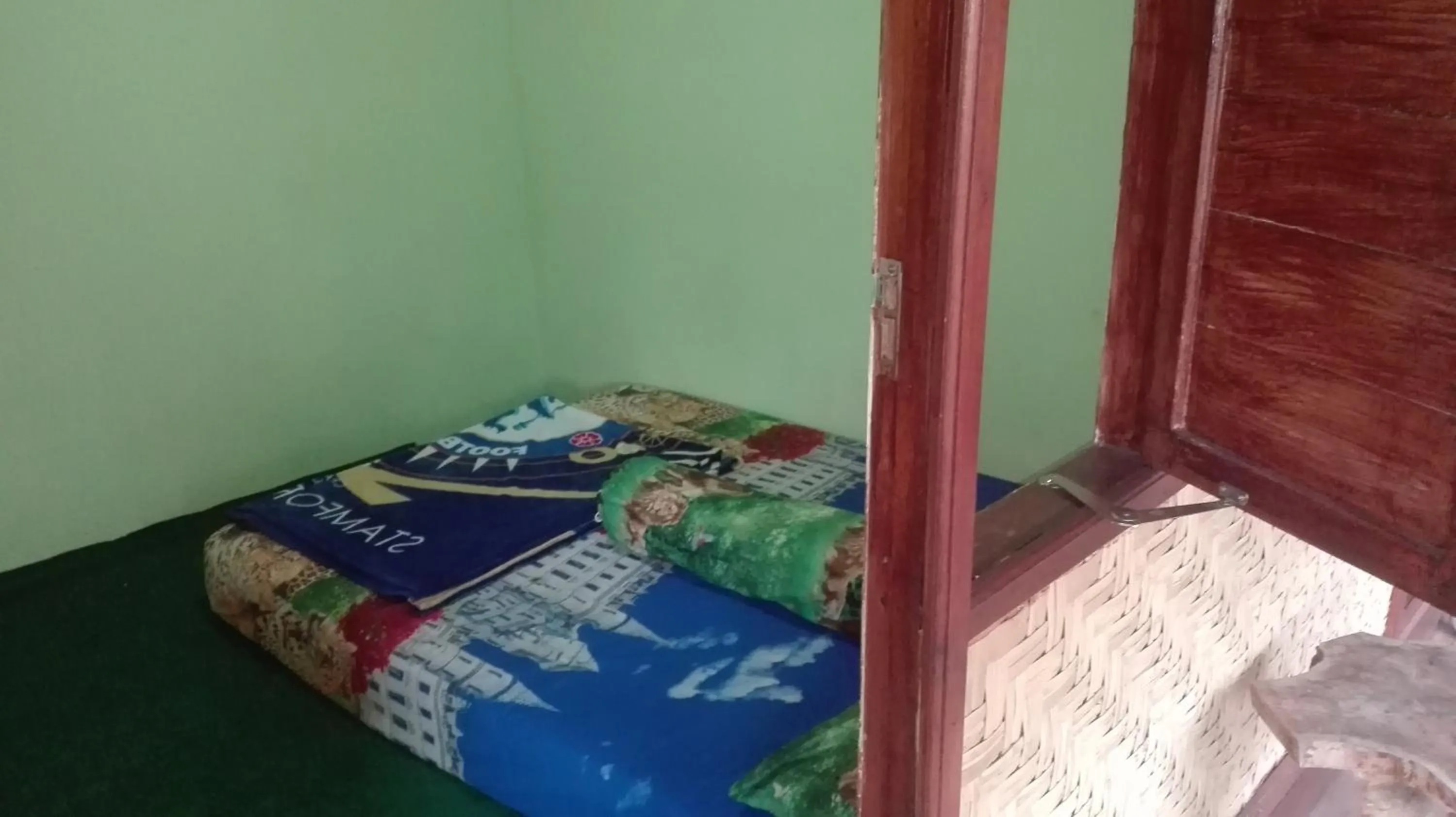 Bed in Ijen Miner Family Homestay