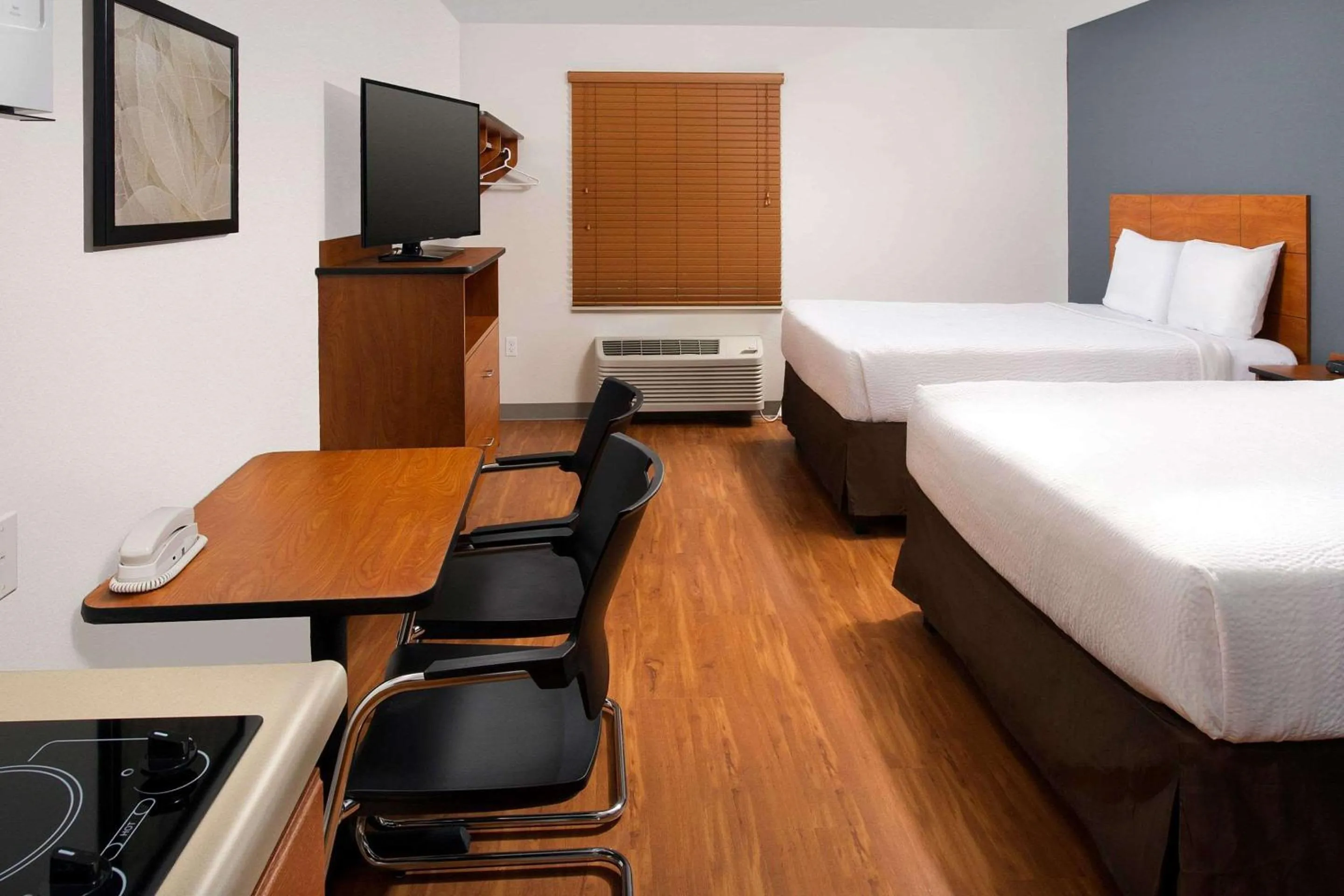 Photo of the whole room, Bed in WoodSpring Suites Chicago Darien