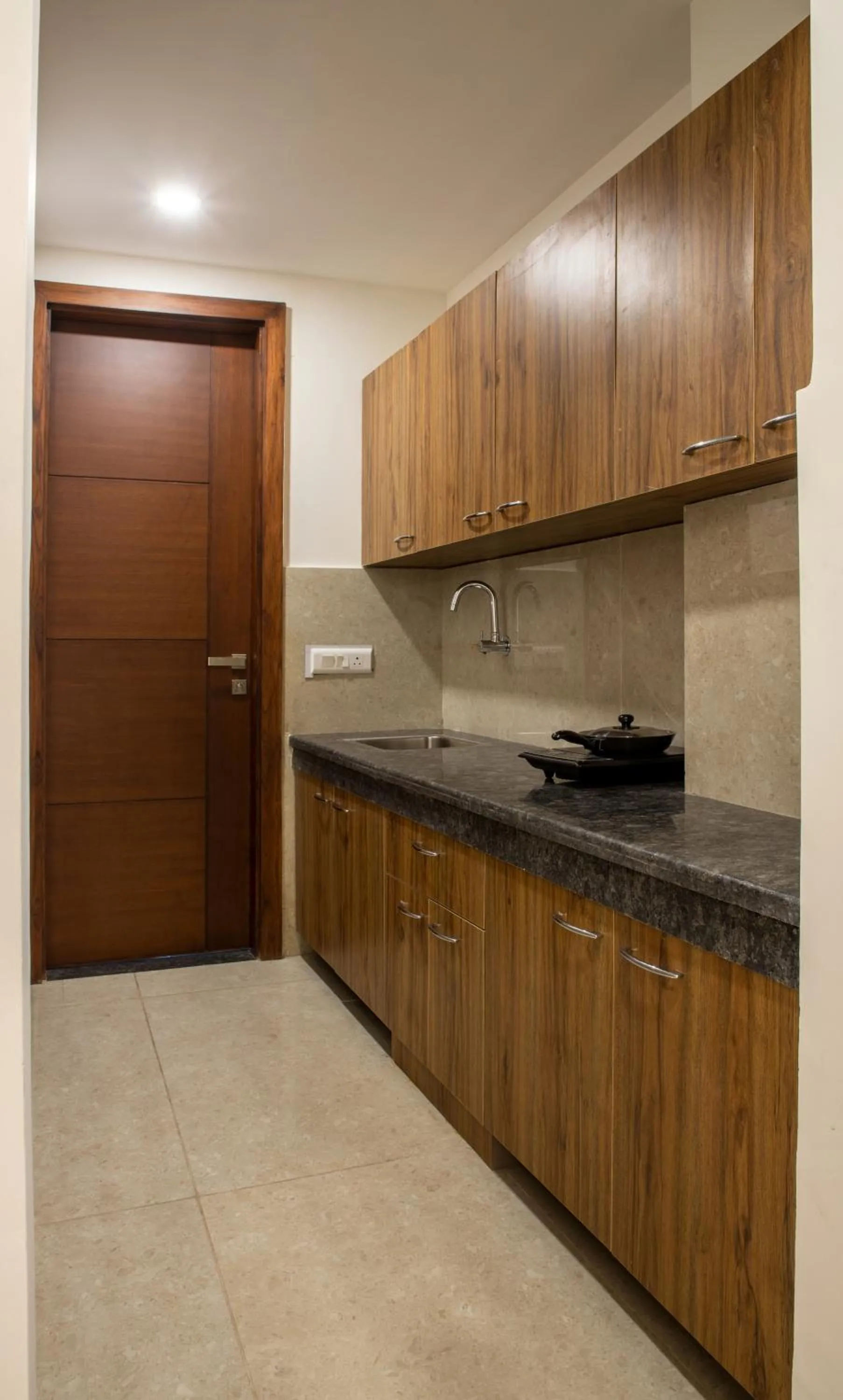 Kitchen or kitchenette in Perch Service Apartment-MG Road