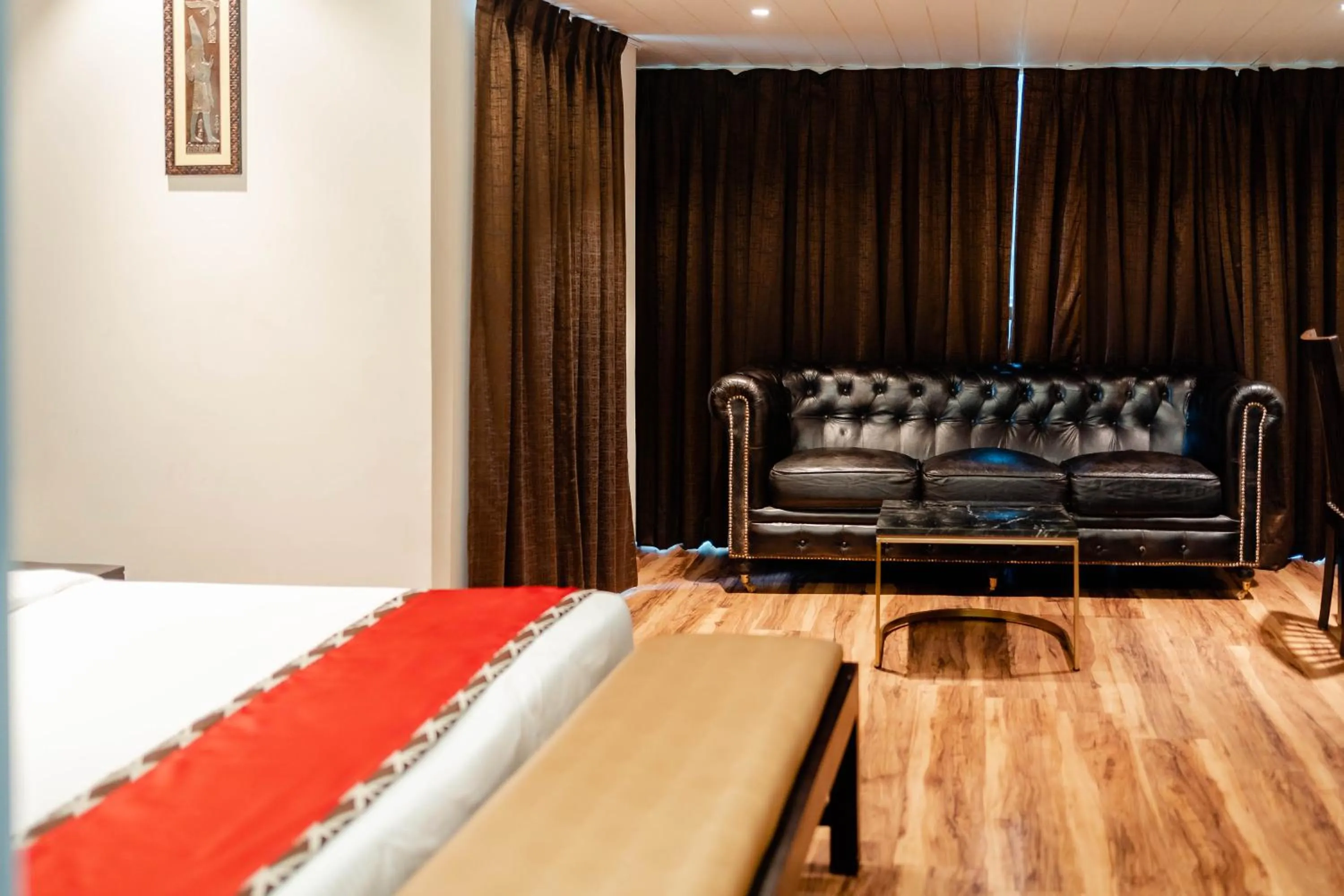 Seating area, Bed in Divan Clarks Inn Goa