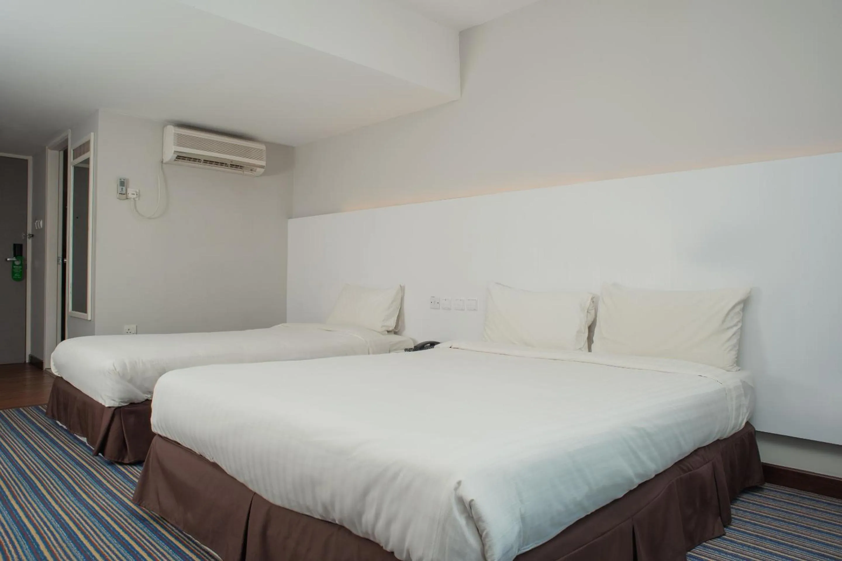 Bedroom in Capital O 90083 Riverfront Inn