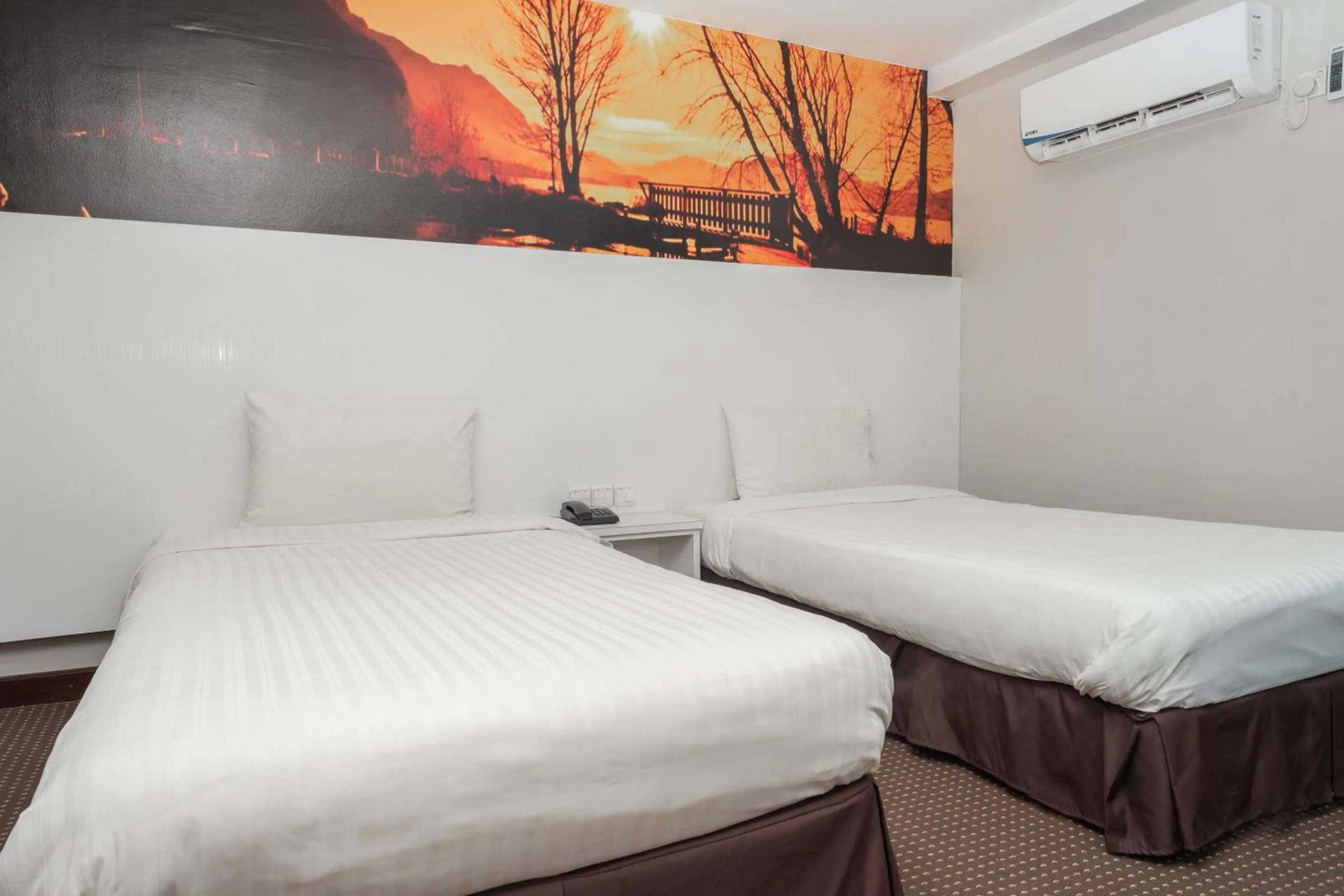 Bedroom in Capital O 90083 Riverfront Inn