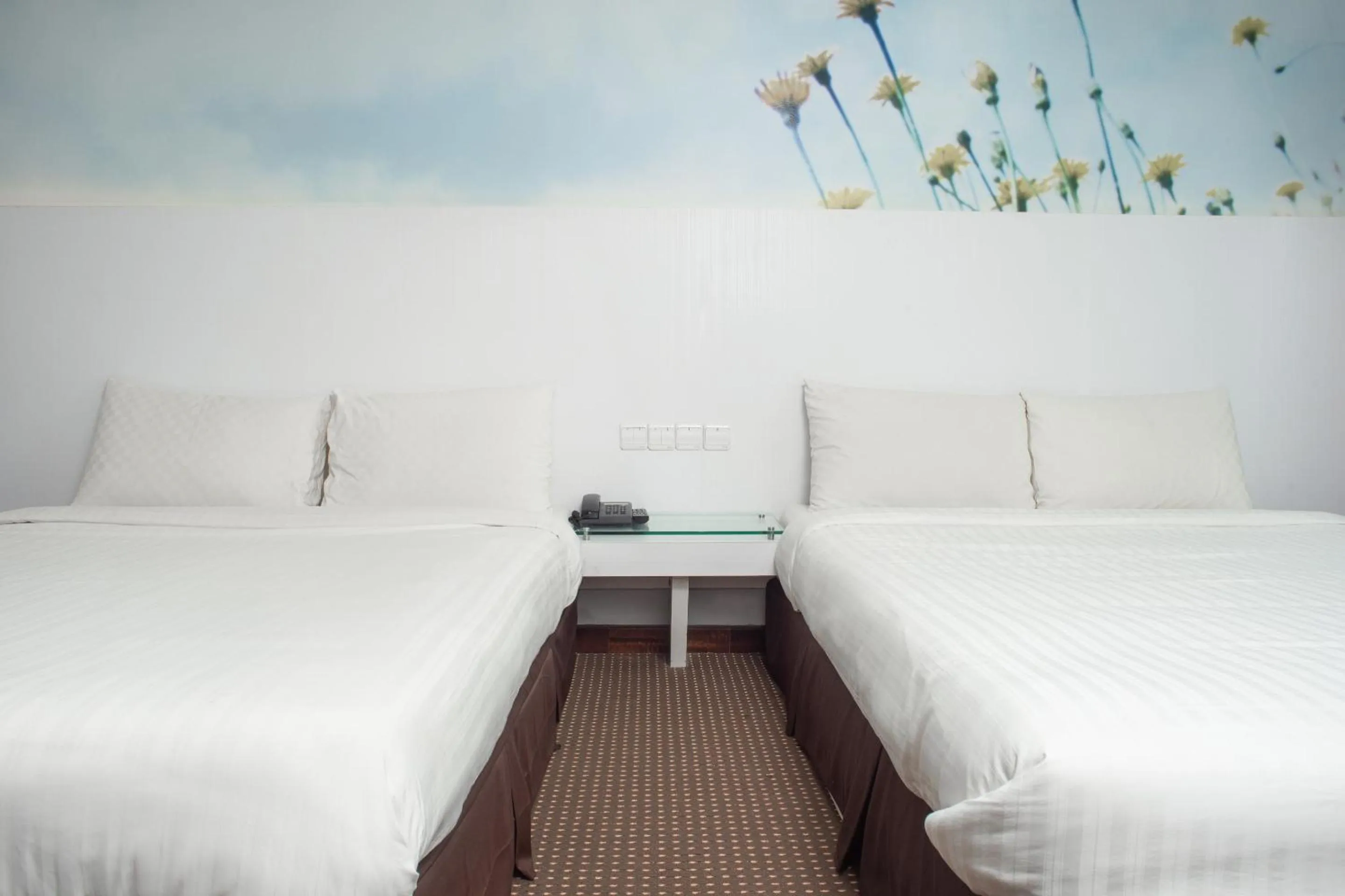 Bedroom in Capital O 90083 Riverfront Inn