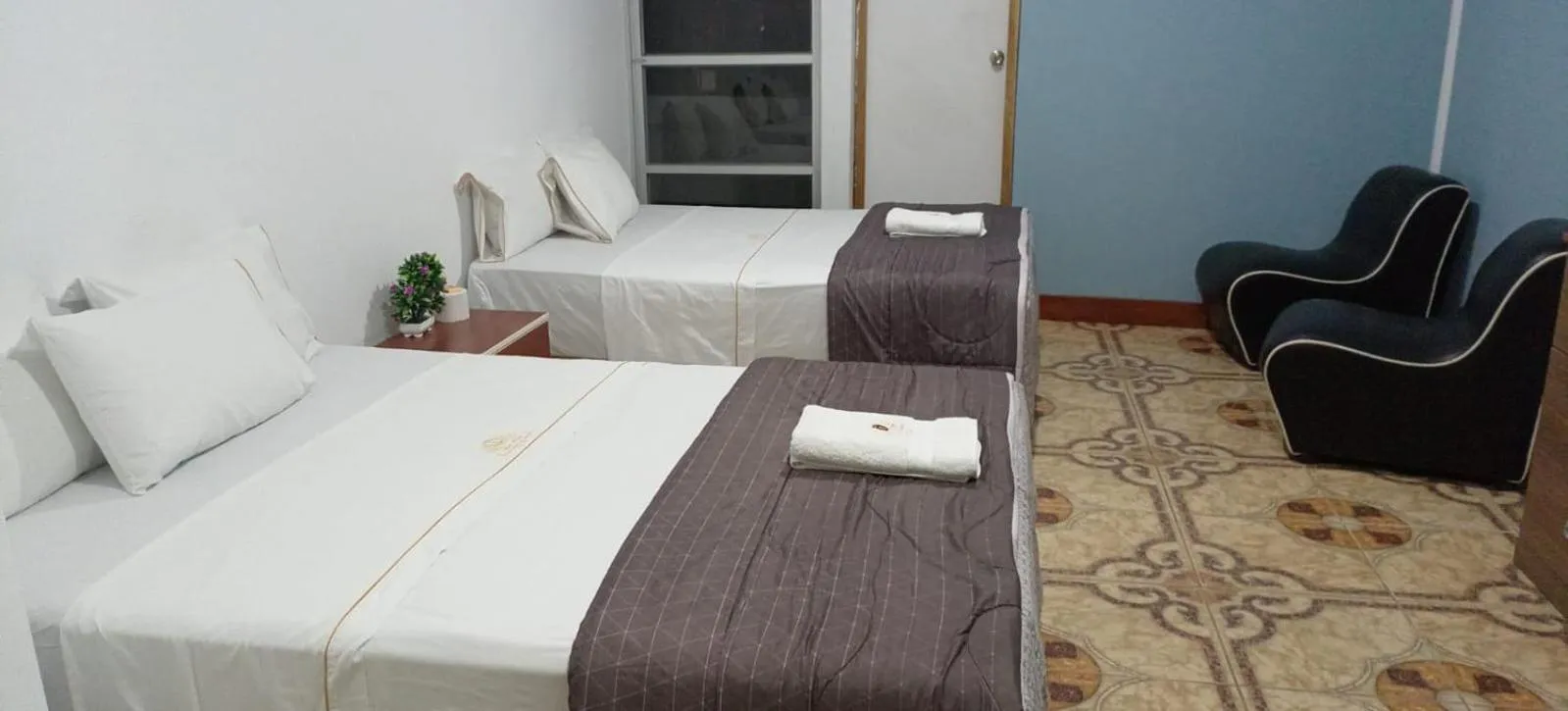 Bed in San Isidro Grand Hotel