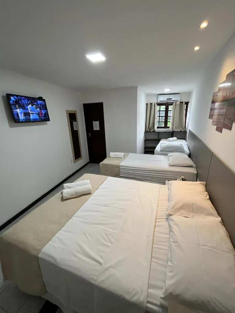 Bed in Pousada La Riviera - Pé na areia e Passeios em Maragogi