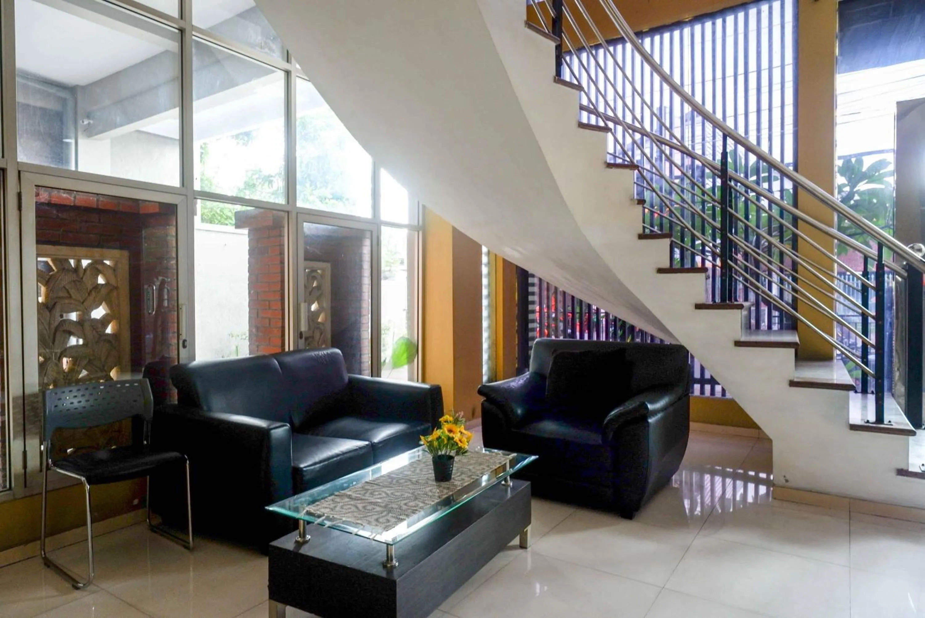 Seating area in RedDoorz Plus near Amplaz Yogyakarta