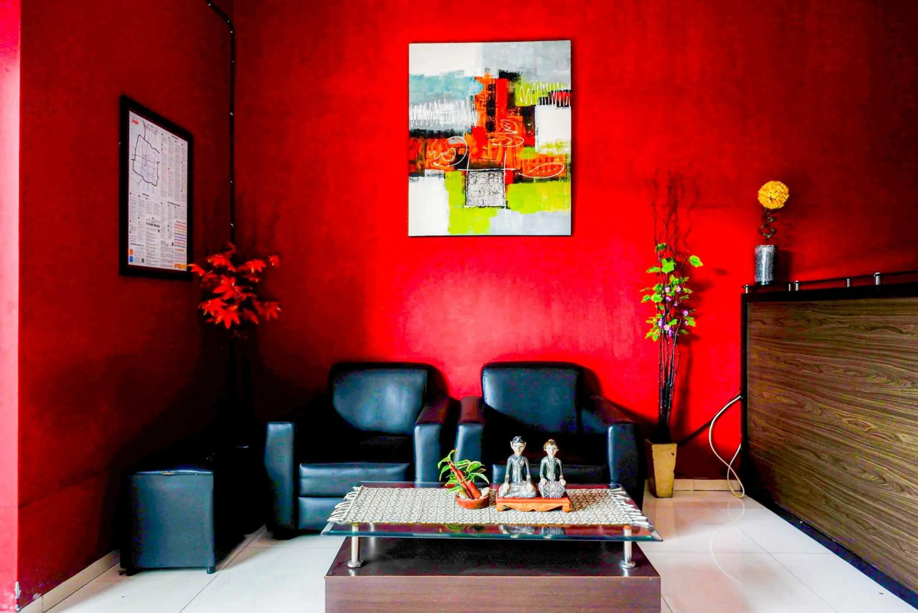 Seating area in RedDoorz Plus near Amplaz Yogyakarta