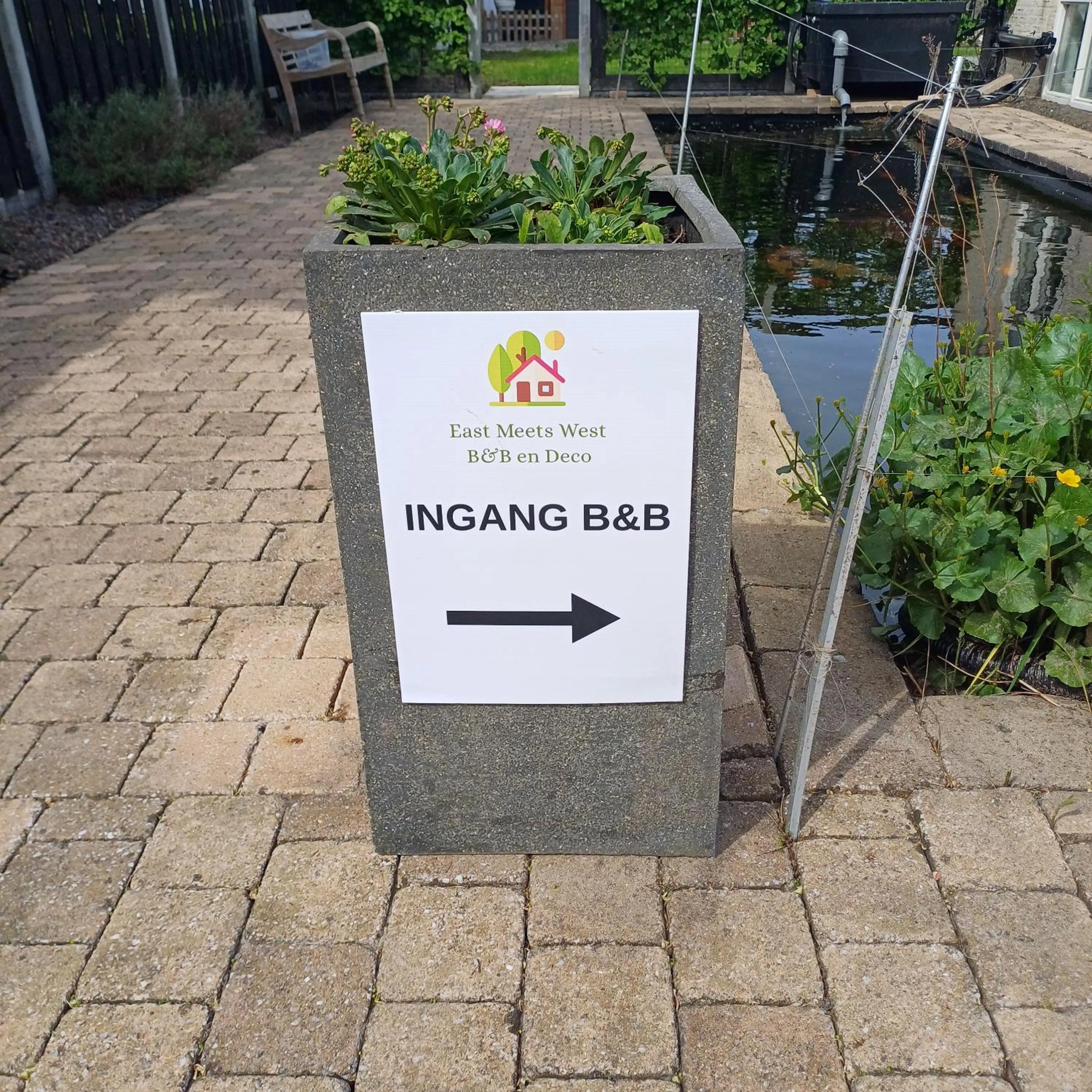 Property logo or sign in East Meets West Bed and Breakfast