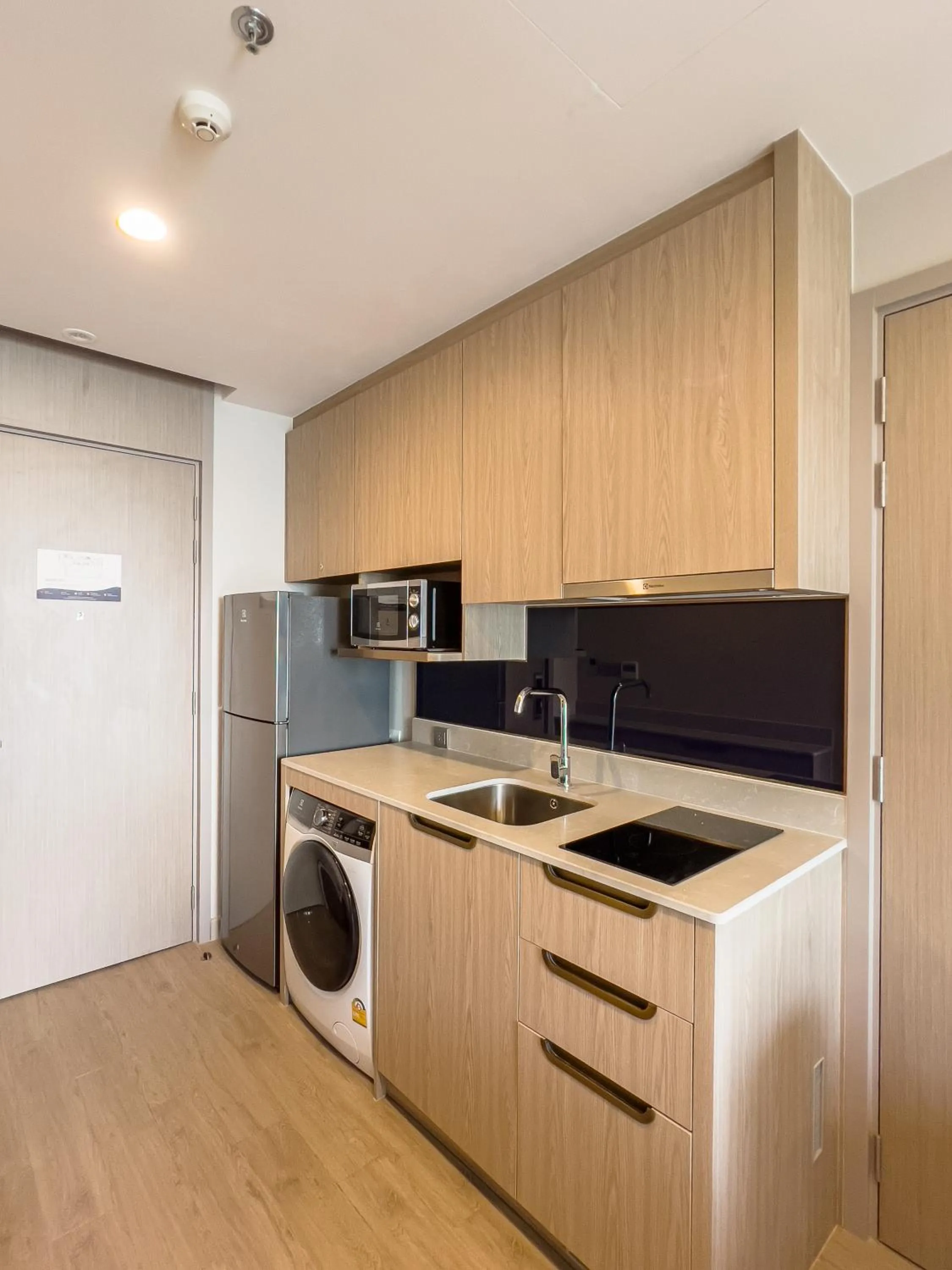 Kitchen or kitchenette in S Sriracha Hotel & Residence