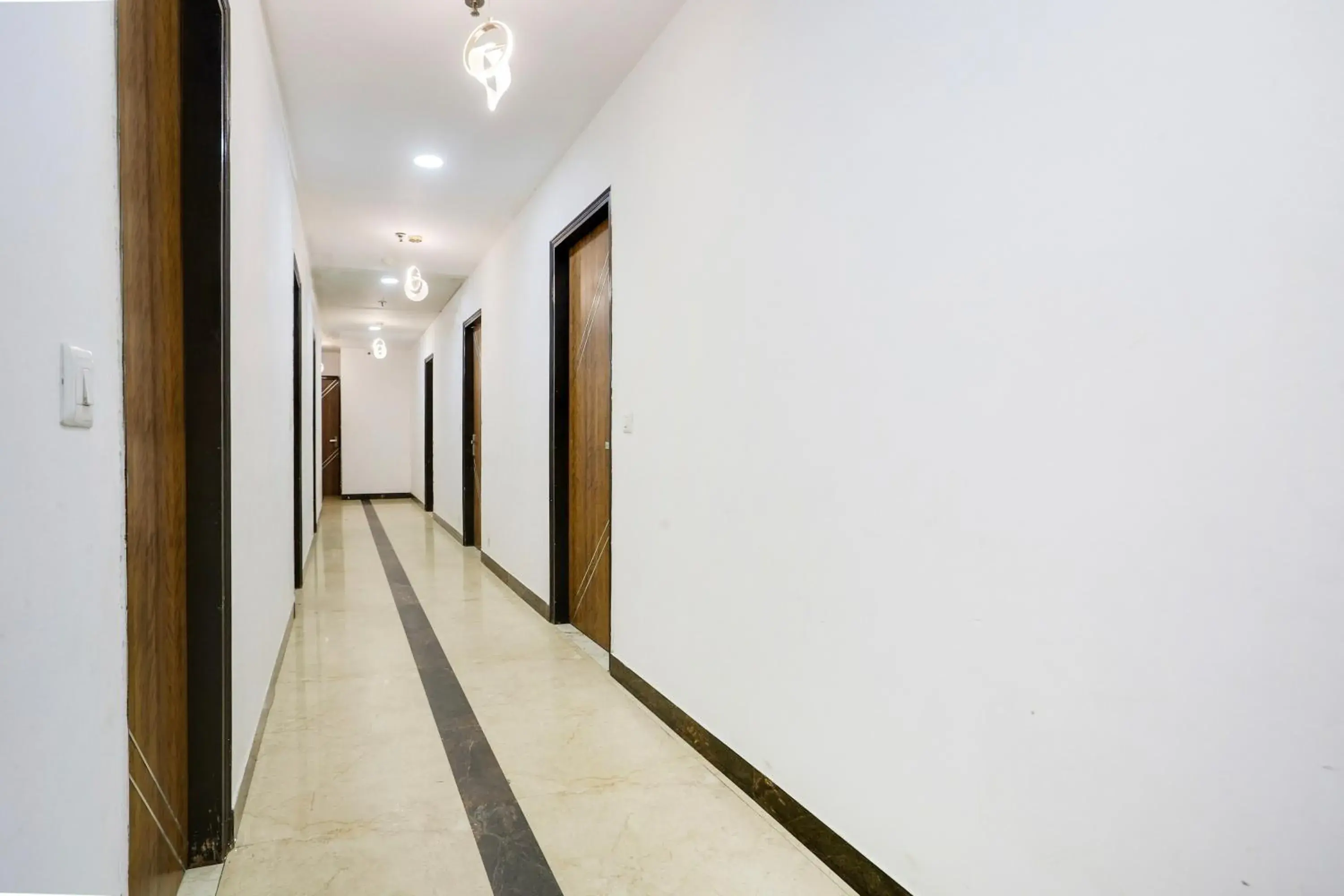 Classic Triple Room - single occupancy in Collection O Golden Key Near TDI Mall Classic Triple Room - single occupancy in Collection O Golden Key Near TDI Mall