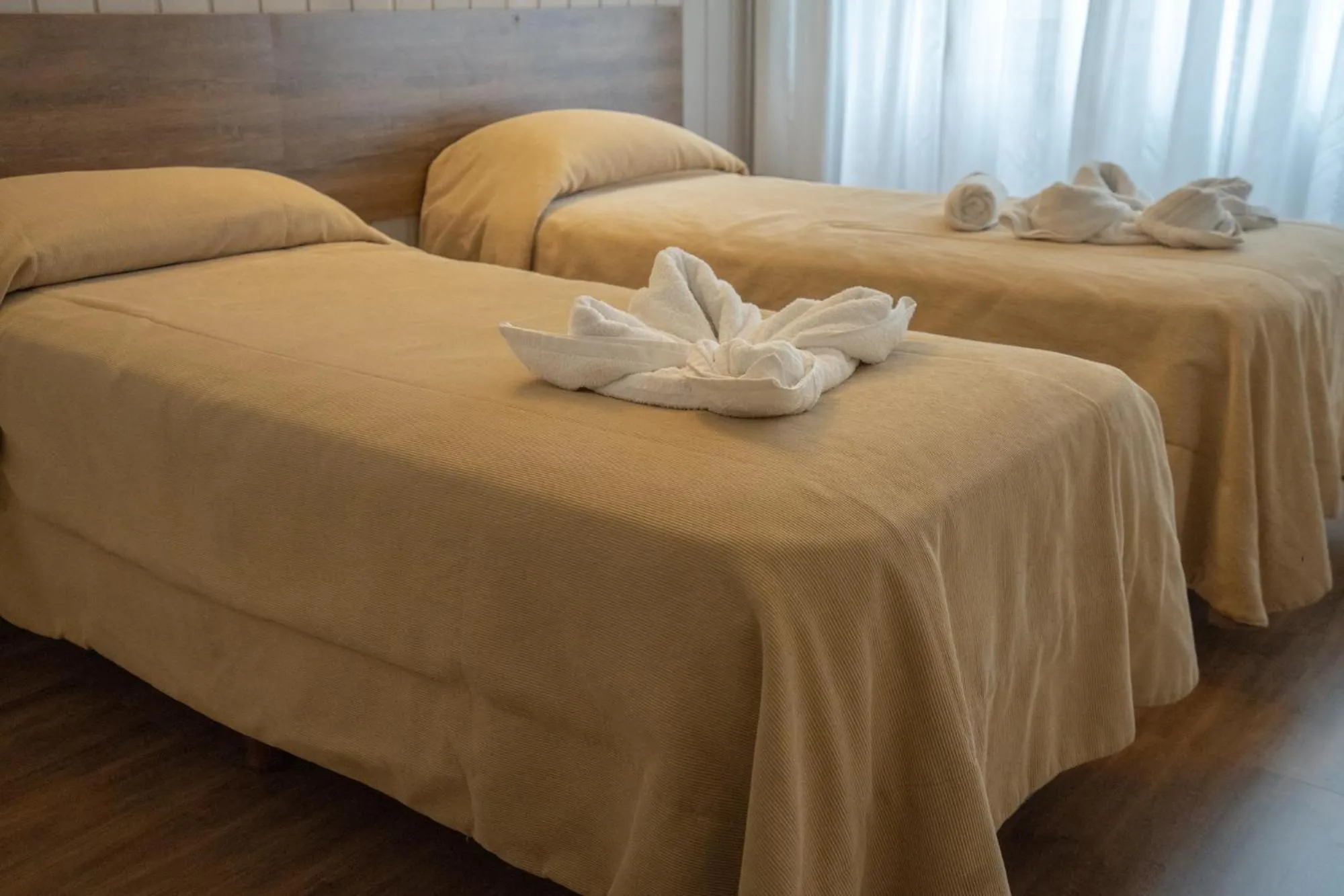 Bed in Tangoinn Club Hotel