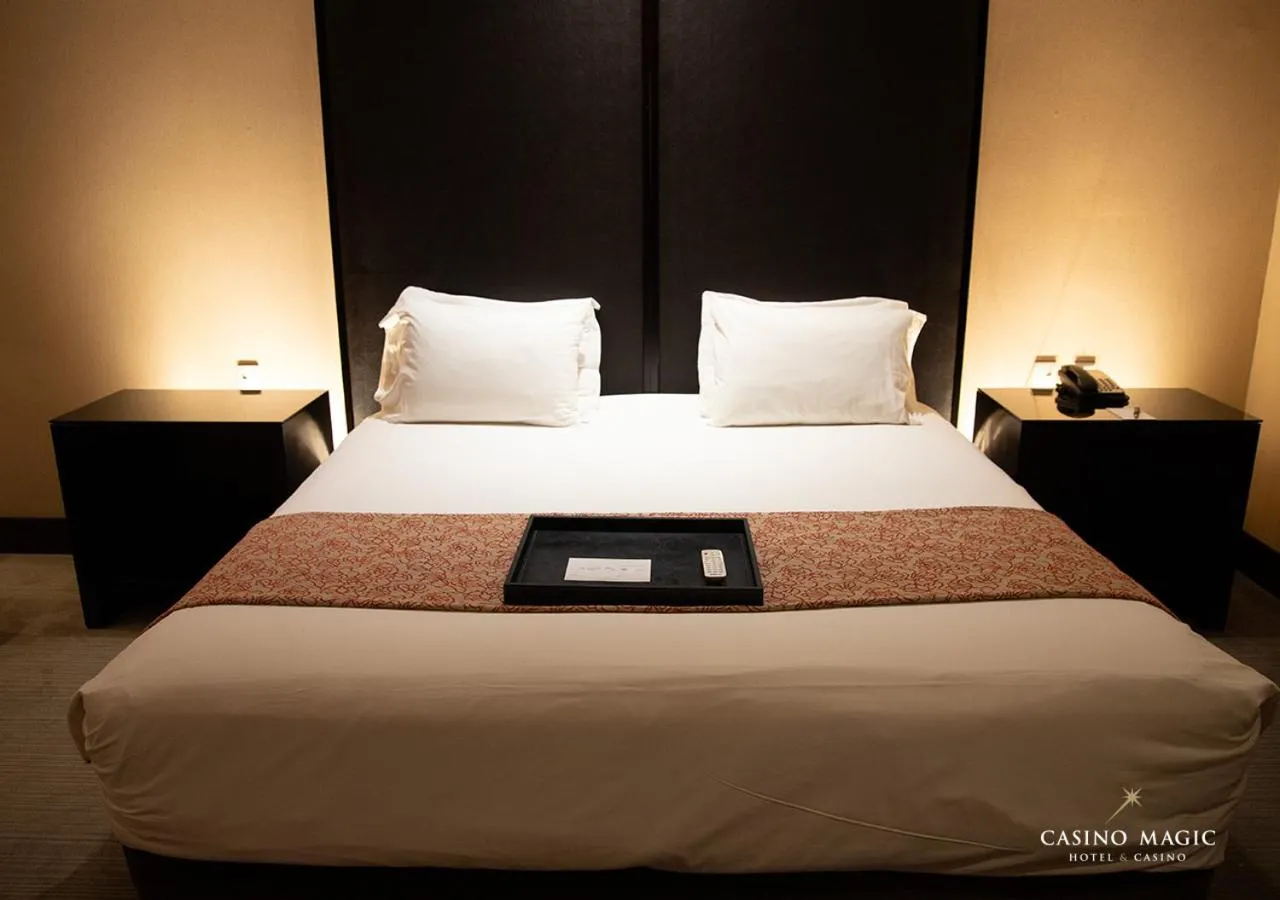 Bed in Hotel Casino Magic
