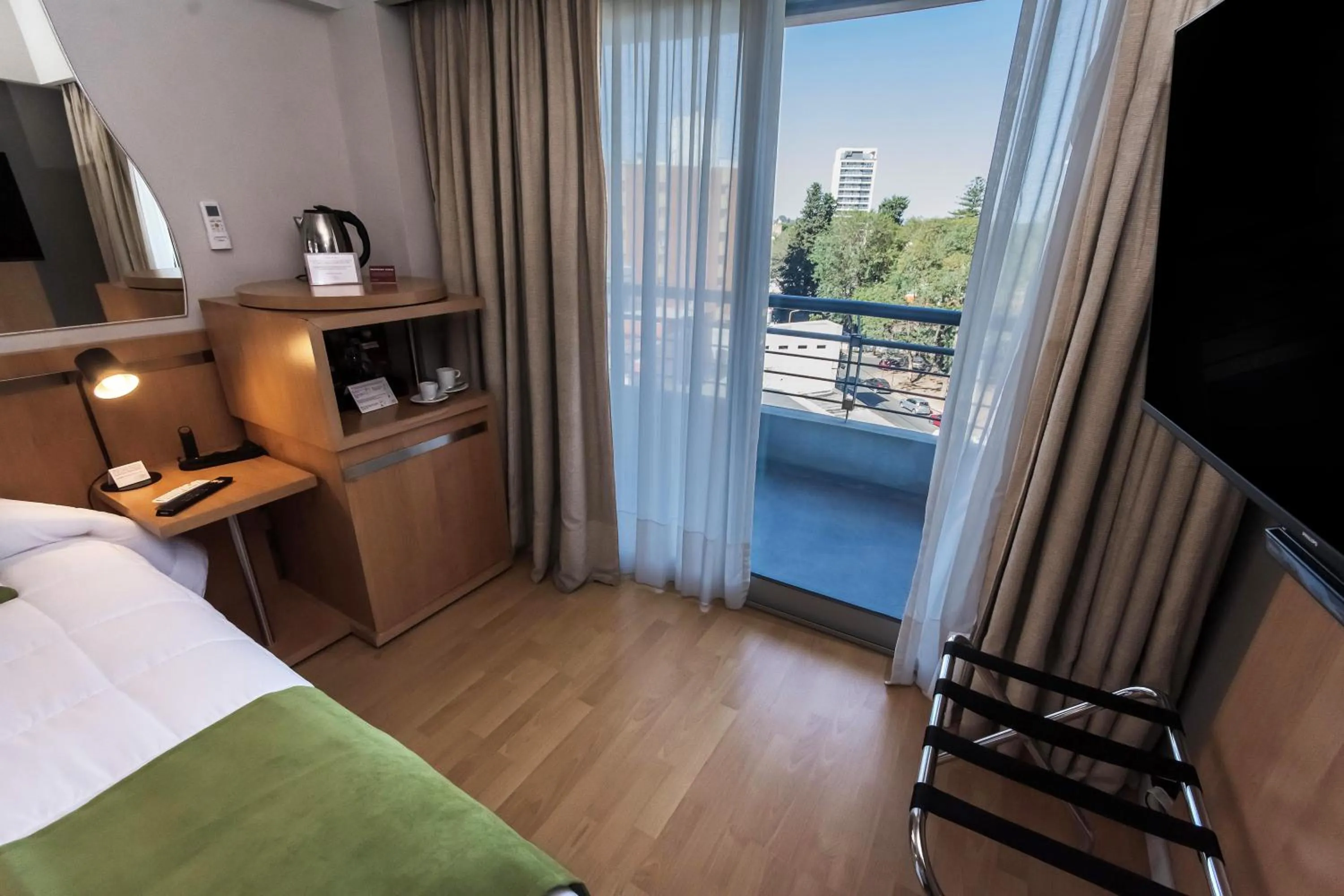 Balcony/Terrace, Bed in Maran Suites & Towers