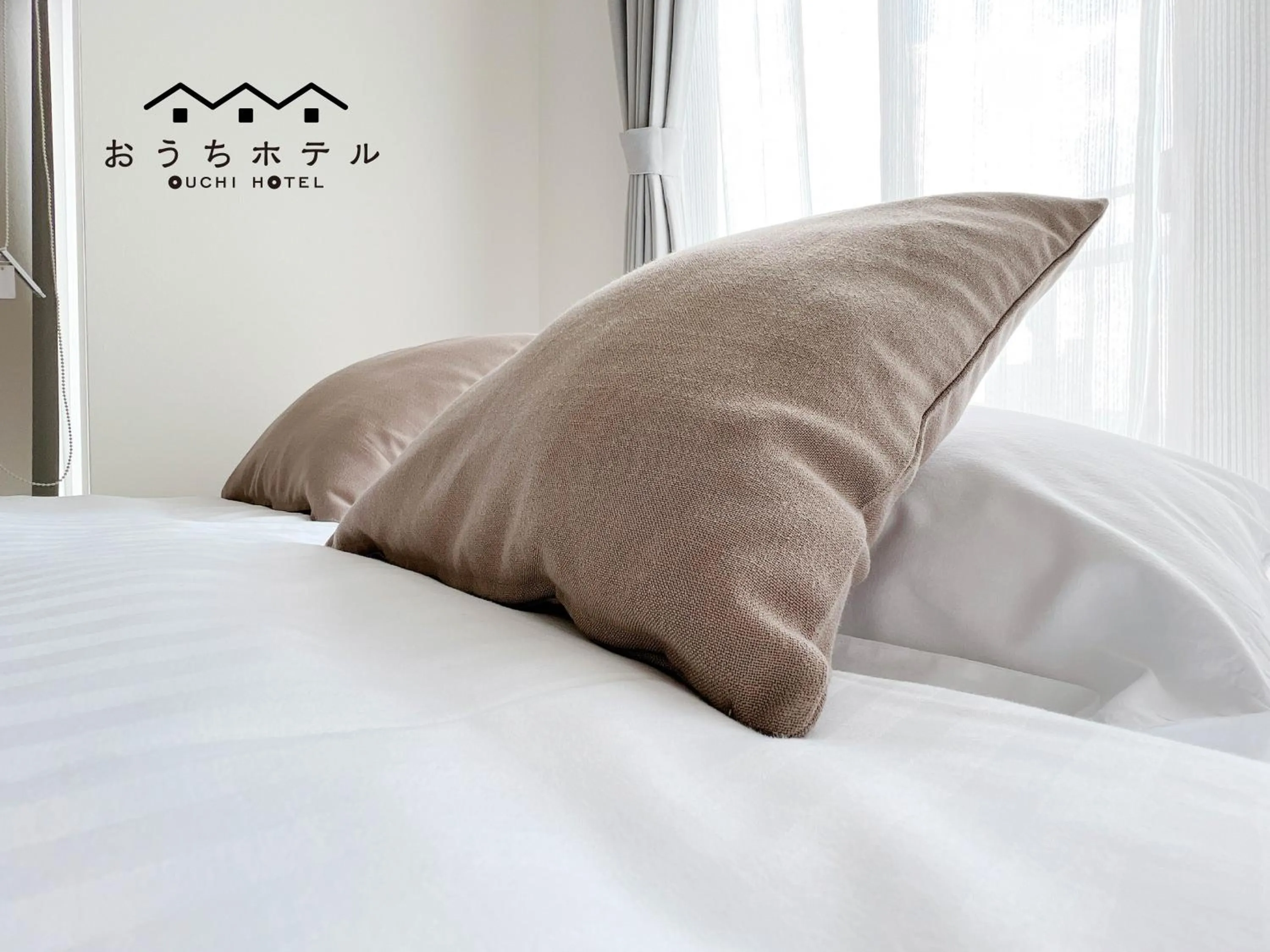 Bed in OUCHI HOTEL Fujimi