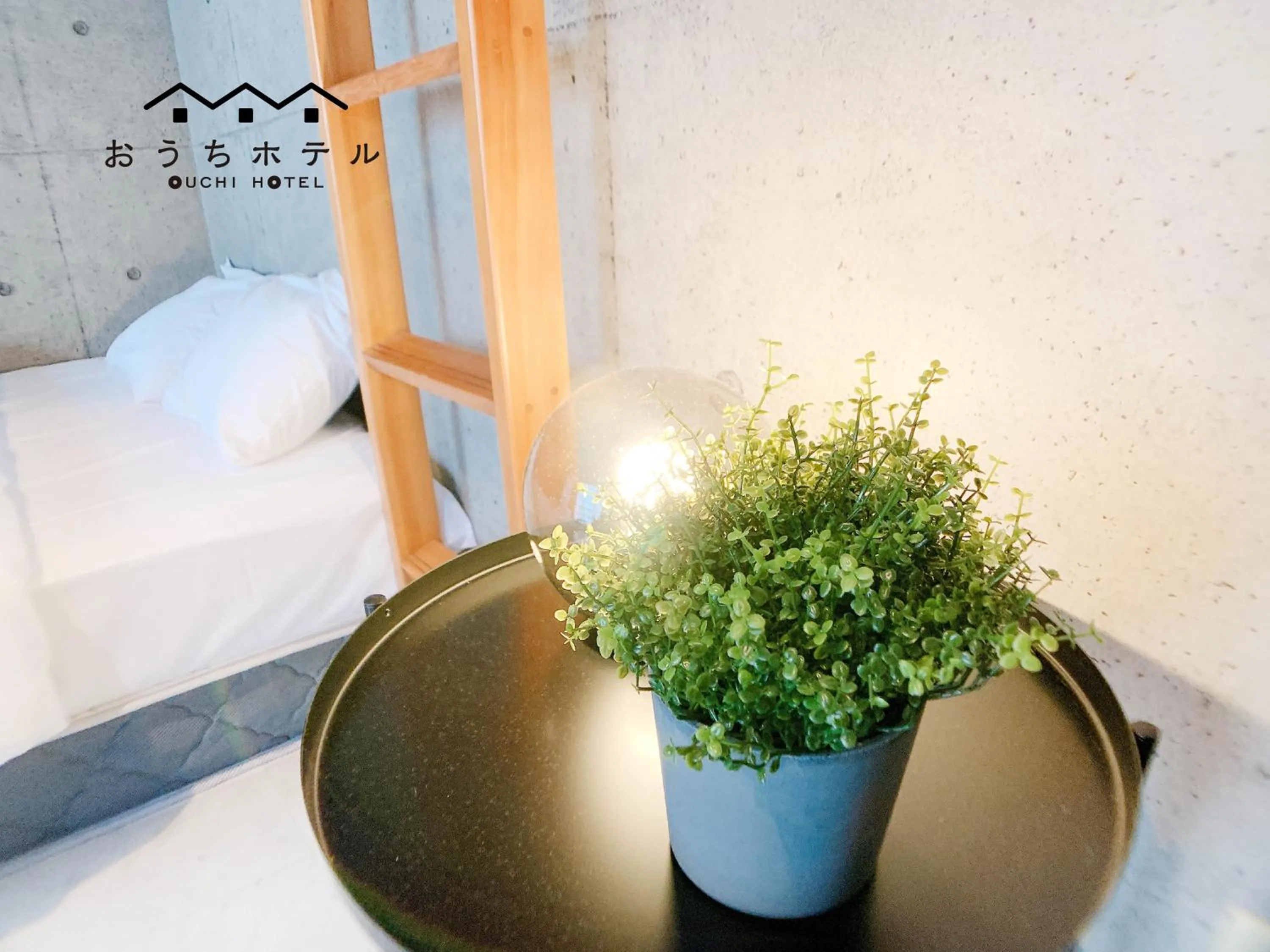 Bed in OUCHI HOTEL Fujimi