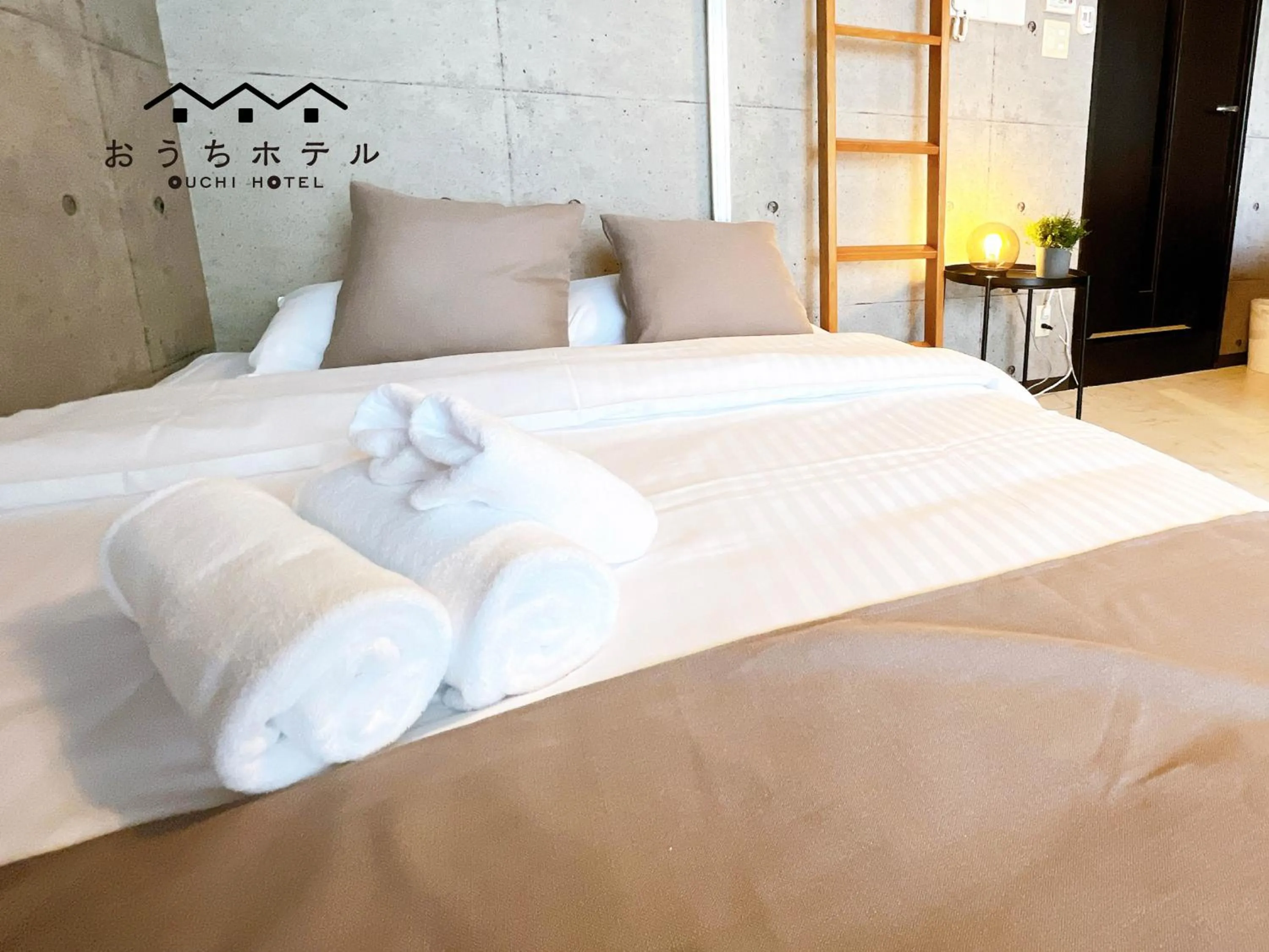 Bed in OUCHI HOTEL Fujimi