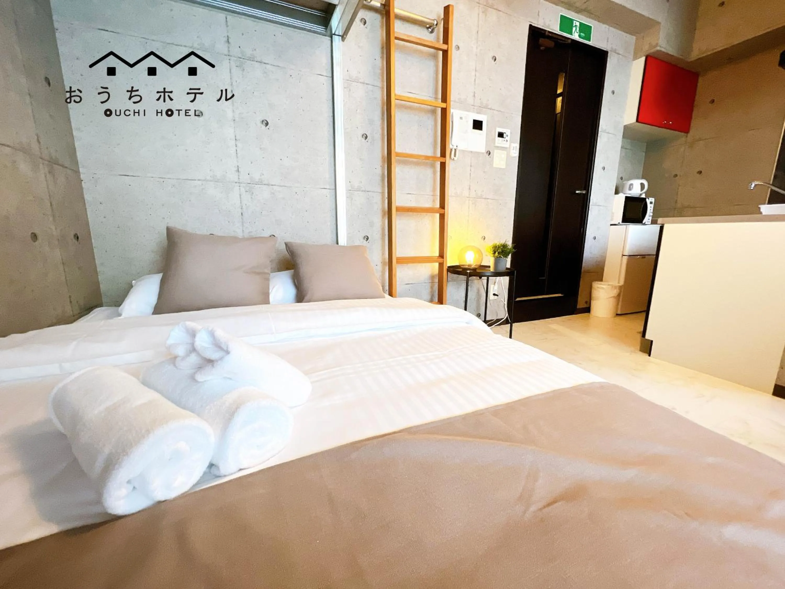 Bed in OUCHI HOTEL Fujimi