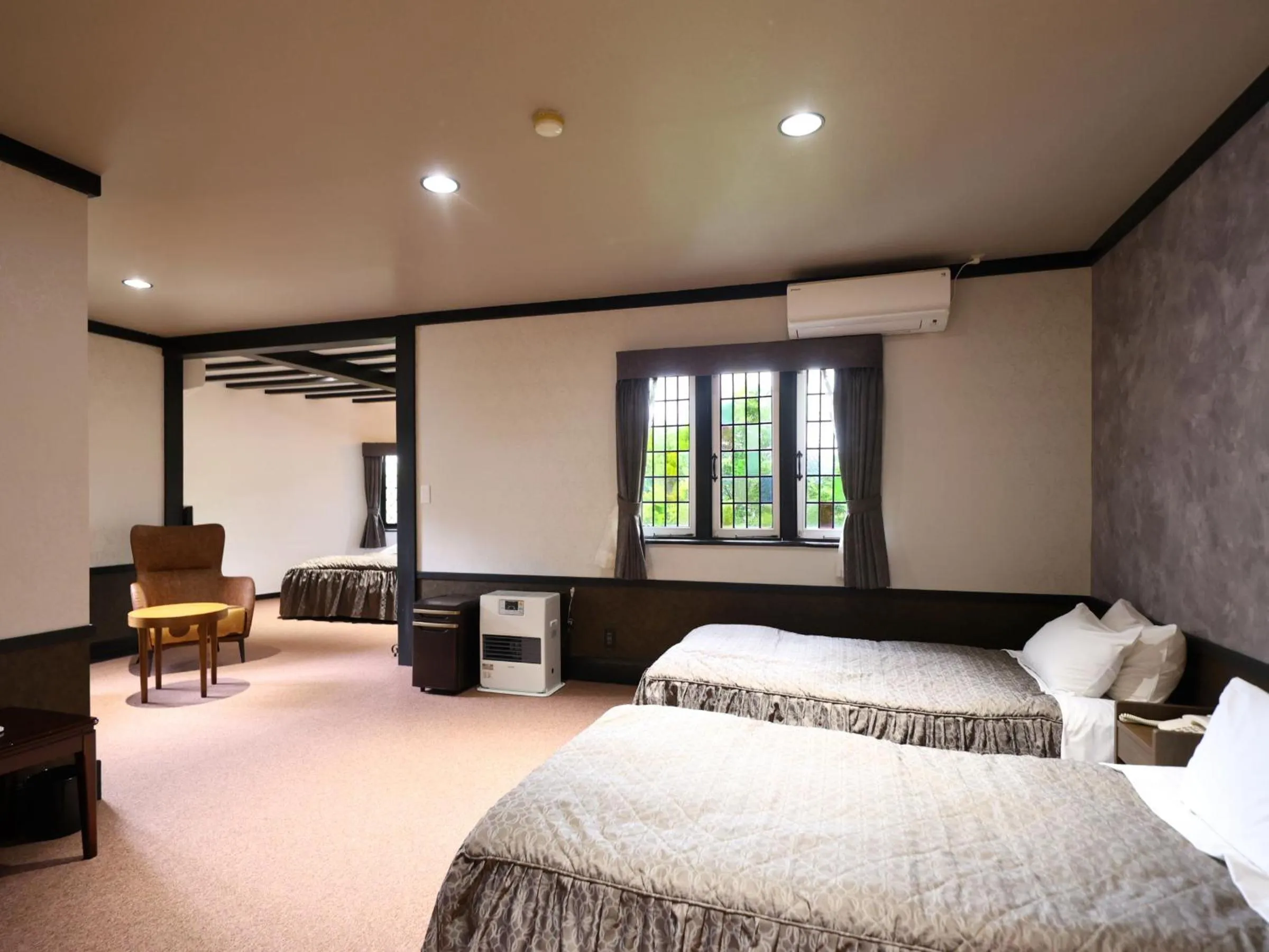 Bed in Petit Hotel & Restaurant Old Age