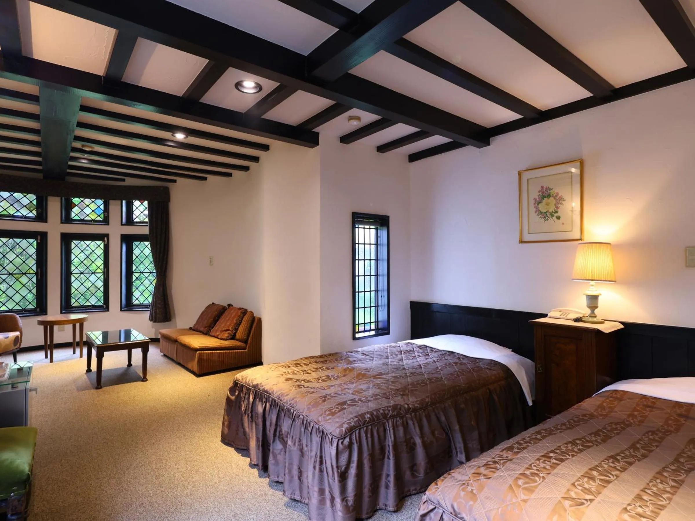 Bed in Petit Hotel & Restaurant Old Age