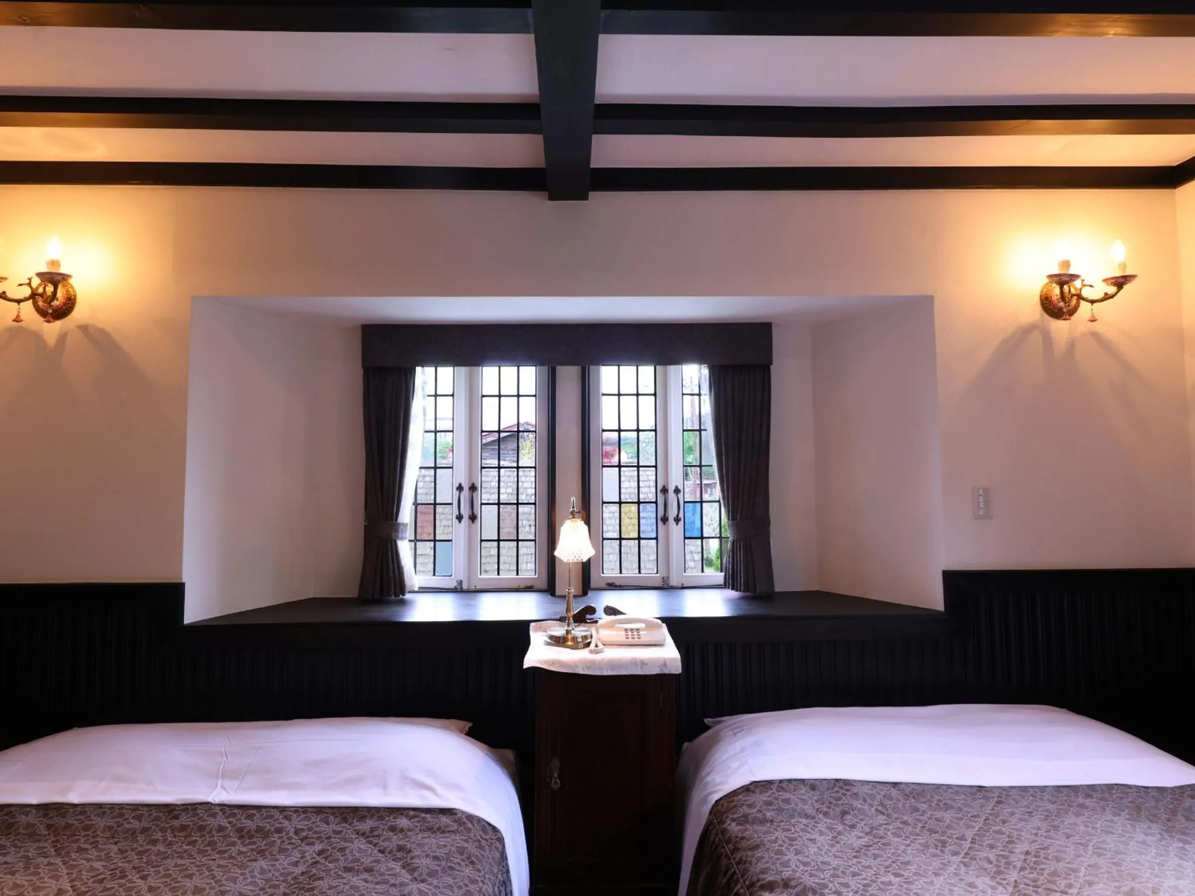 Bed in Petit Hotel & Restaurant Old Age