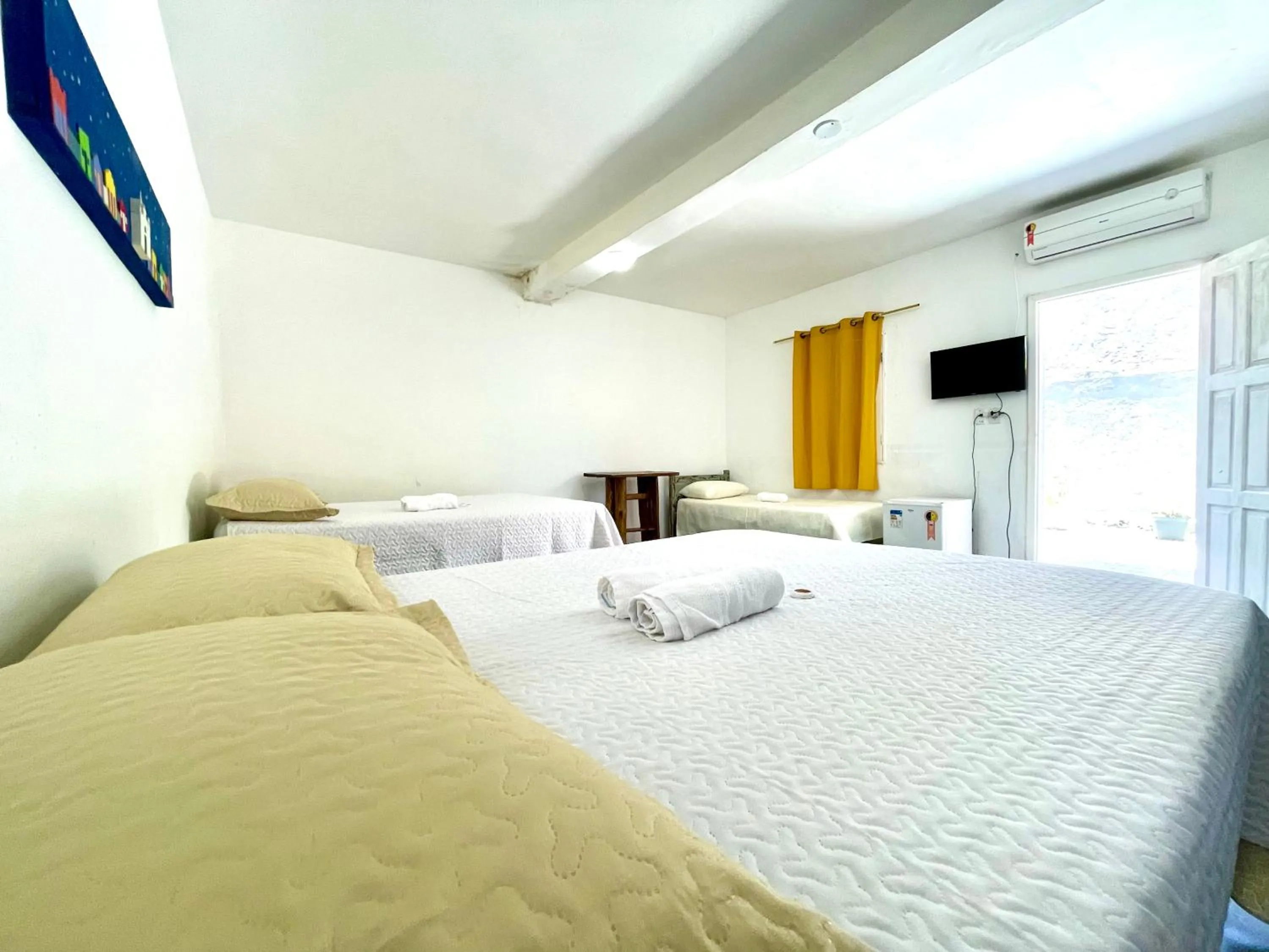 Bed in Pousada Kawaii