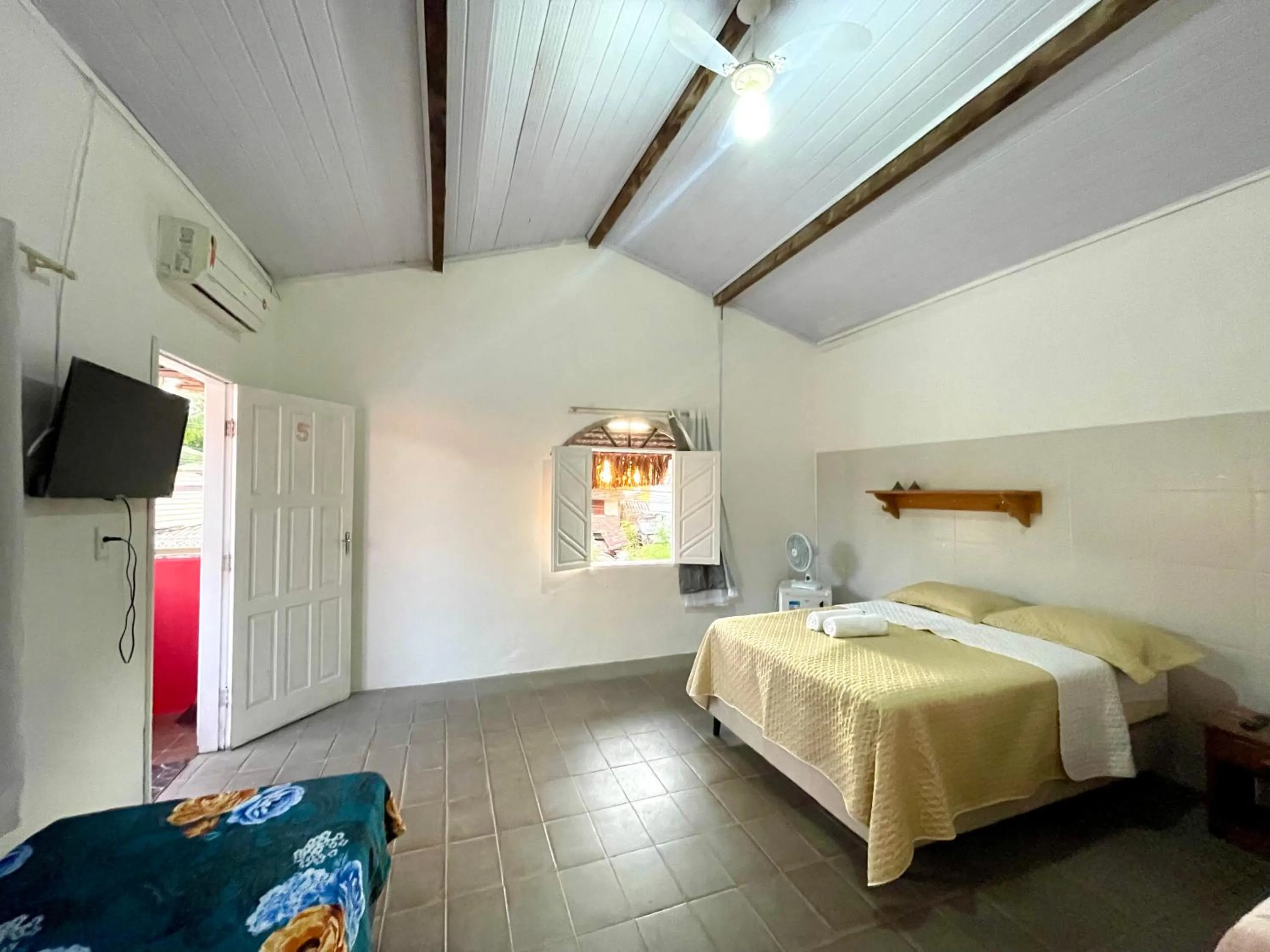 Bed in Pousada Kawaii