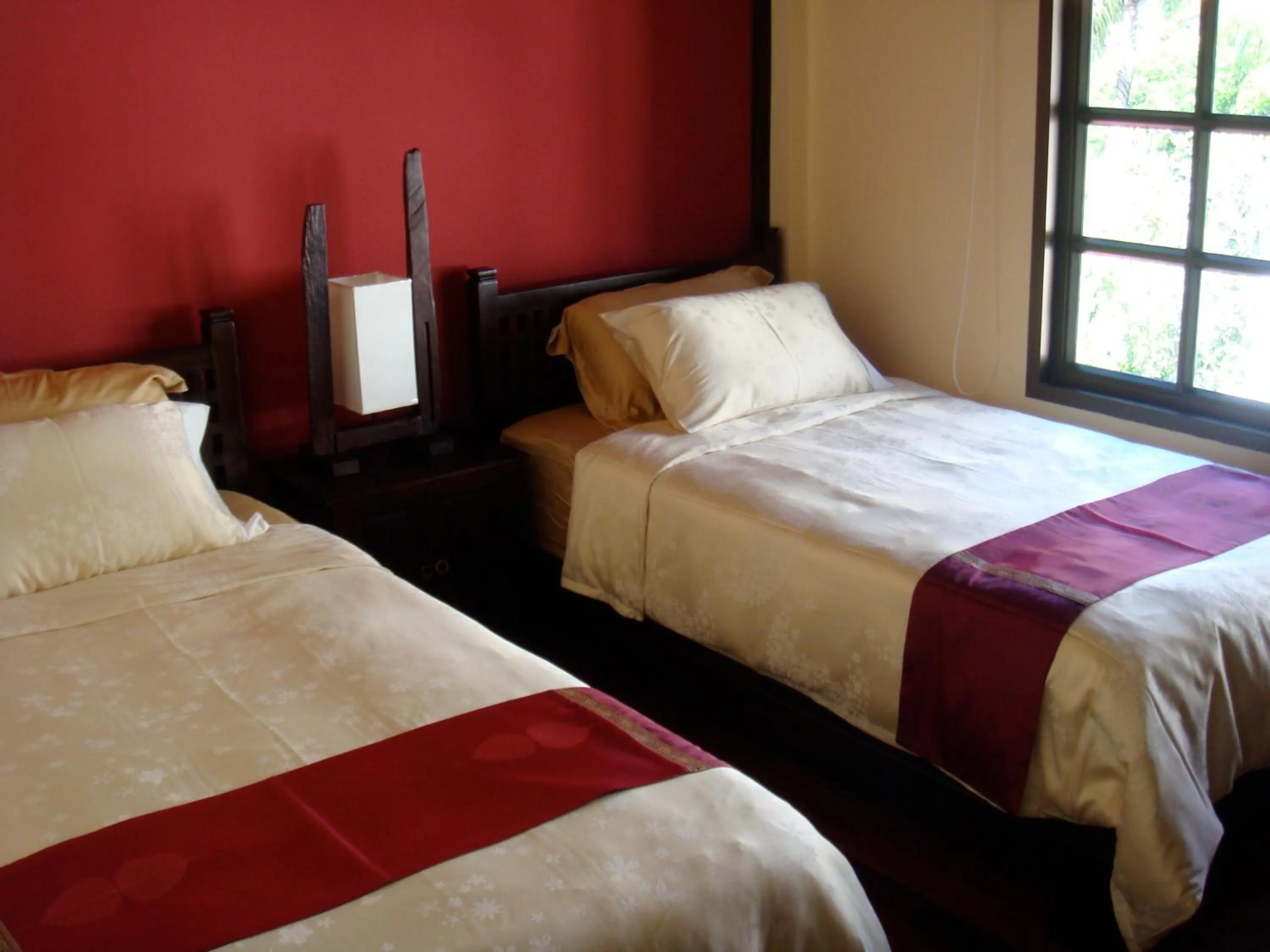 Bed in Sunset Apartment Phuket