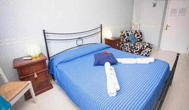 Photo of the whole room, Bed in La Casa Romana